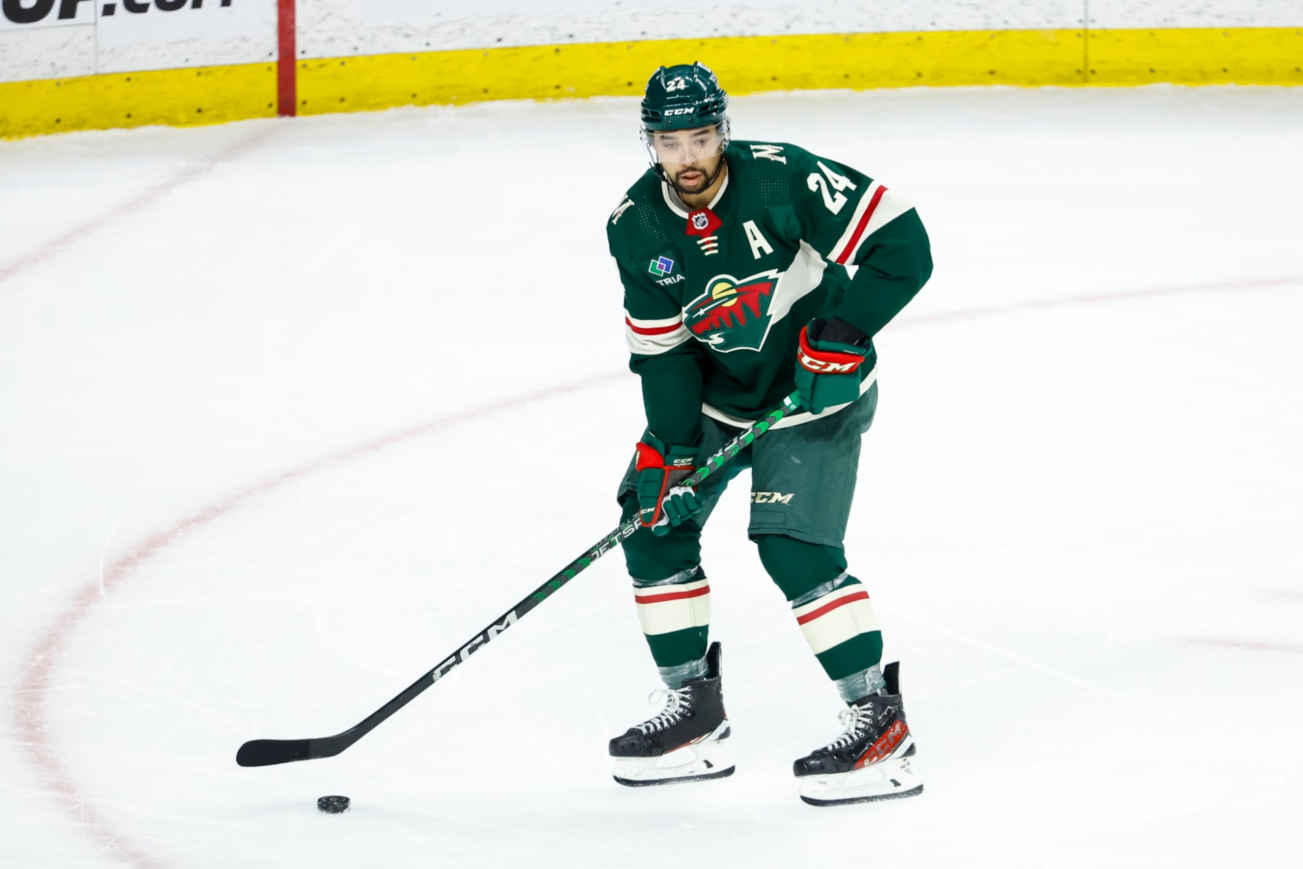 ST PAUL, MN - APRIL 23: Matt Dumba #24 of the Minnesota Wild skates with the puck against the Dallas Stars in the third period of Game Four of the First Round of the 2023 Stanley Cup Playoffs at Xcel Energy Center on April 23, 2023 in St Paul, Minnesota. The Stars defeated the Wild 3-2 to tie the series 2-2. (Photo by David Berding/Getty Images)