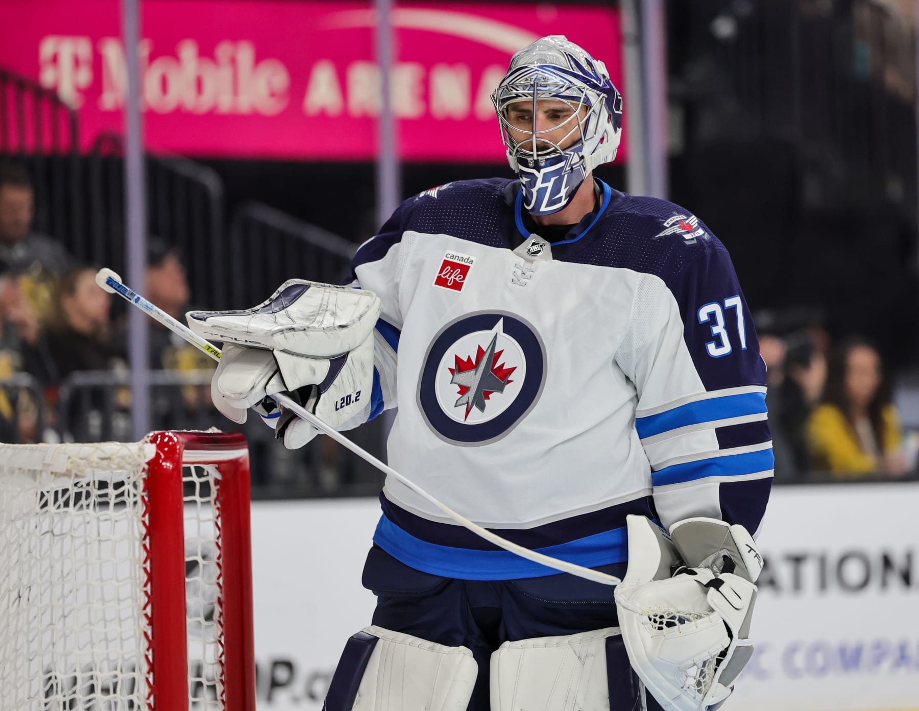 LAS VEGAS, NEVADA - APRIL 18: Connor Hellebuyck #37 of the Winnipeg Jets takes a break during a stop in play in the second period against the Vegas Golden Knights in Game One of the First Round of the 2023 Stanley Cup Playoffs at T-Mobile Arena on April 18, 2023 in Las Vegas, Nevada. The Jets defeated the Golden Knights 5-1. (Photo by Ethan Miller/Getty Images)