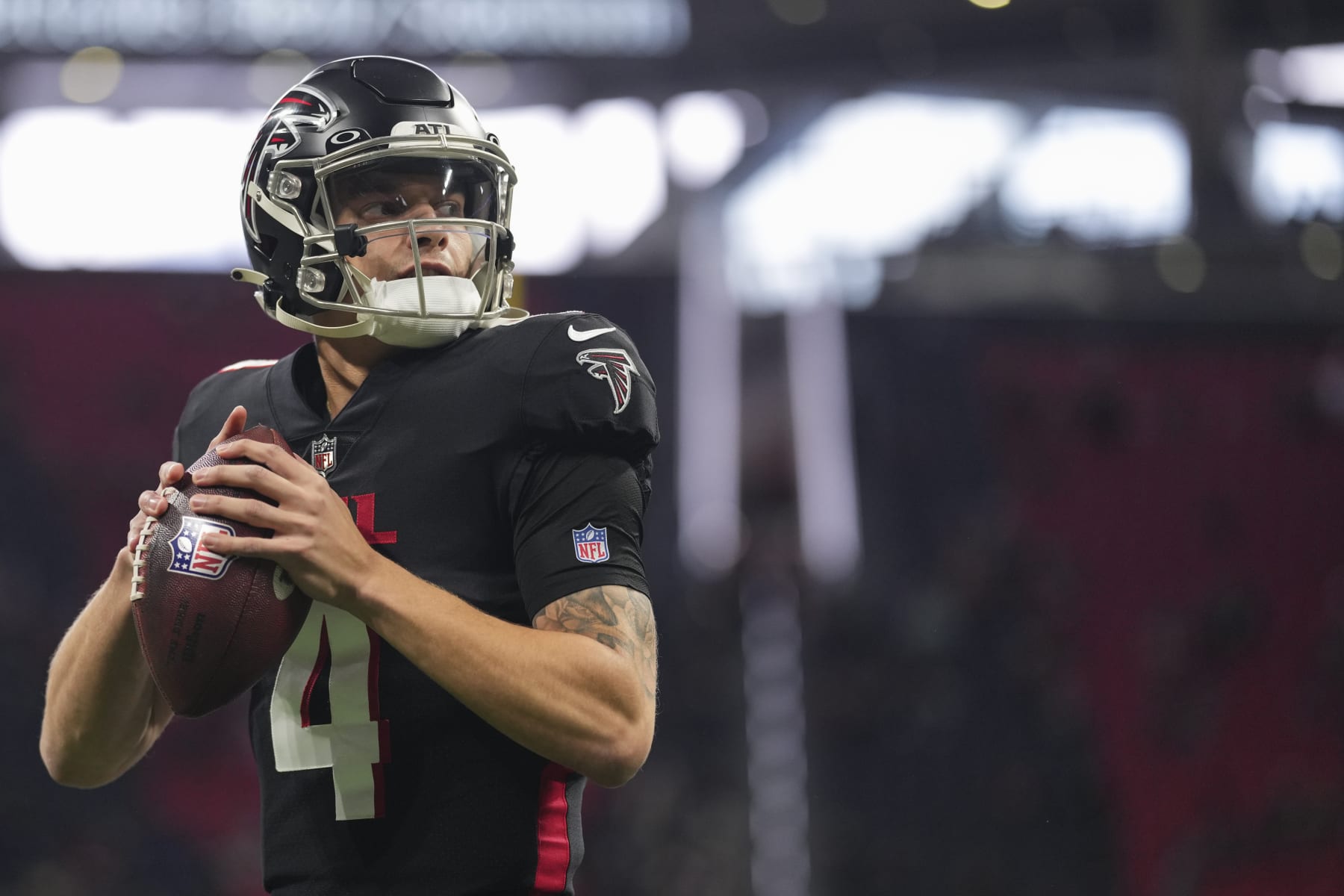 ATLANTA, GA - JANUARY 08: Desmond Ridder #4 of the Atlanta Falcons warms up against the Tampa Bay Buccaneers at Mercedes-Benz Stadium on January 8, 2023 in Atlanta, Georgia. (Photo by Cooper Neill/Getty Images)