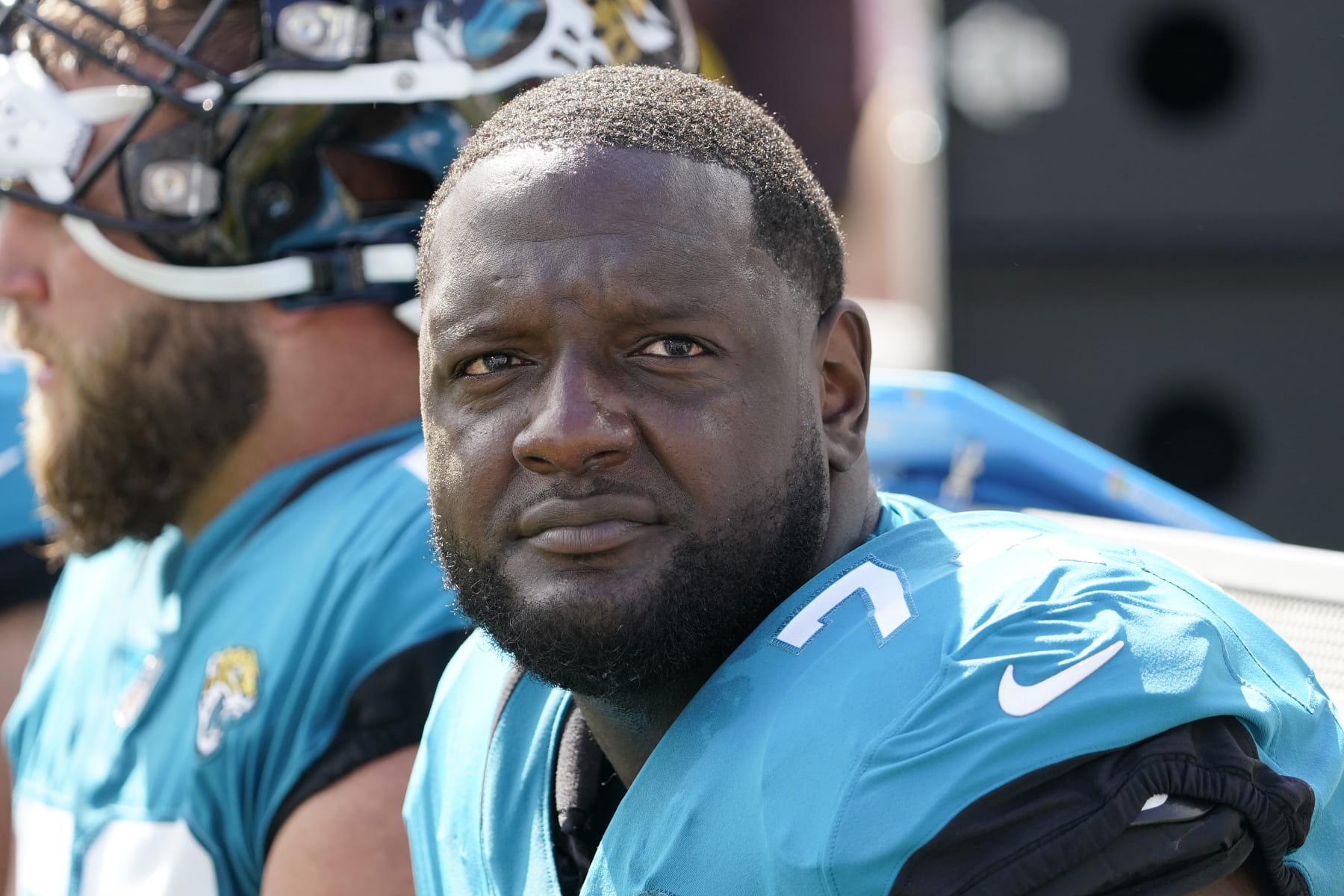 FILE - Jacksonville Jaguars offensive tackle Cam Robinson (74) watches play against the New York Giants during the first half of an NFL football game Sunday, Oct. 23, 2022, in Jacksonville, Fla. A person familiar with the situation says Jacksonville Jaguars left tackle Cam Robinson is facing a multigame suspension for violating the NFL's policy on performance-enhancing drugs. The person spoke to The Associated Press on condition of anonymity Thursday, April 27, 2023, because the suspension has not been announced and is pending the result of a B sample. (AP Photo/John Raoux, File)