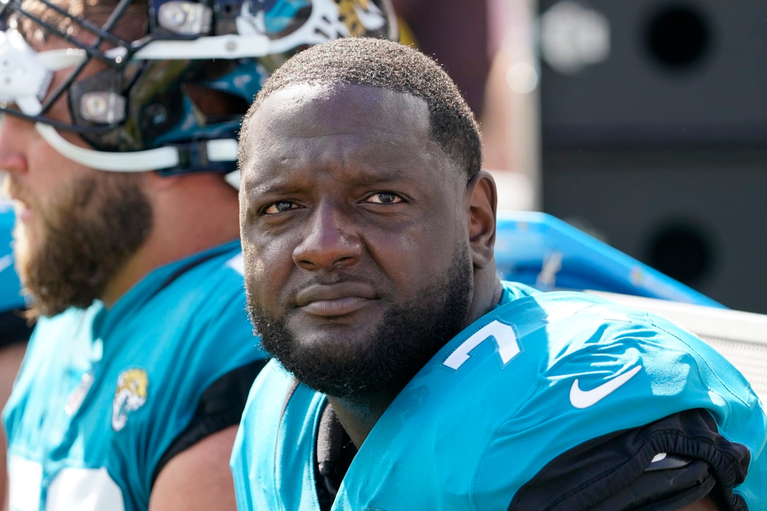 FILE - Jacksonville Jaguars offensive tackle Cam Robinson (74) watches play against the New York Giants during the first half of an NFL football game Sunday, Oct. 23, 2022, in Jacksonville, Fla. A person familiar with the situation says Jacksonville Jaguars left tackle Cam Robinson is facing a multigame suspension for violating the NFL's policy on performance-enhancing drugs. The person spoke to The Associated Press on condition of anonymity Thursday, April 27, 2023, because the suspension has not been announced and is pending the result of a B sample. (AP Photo/John Raoux, File)
