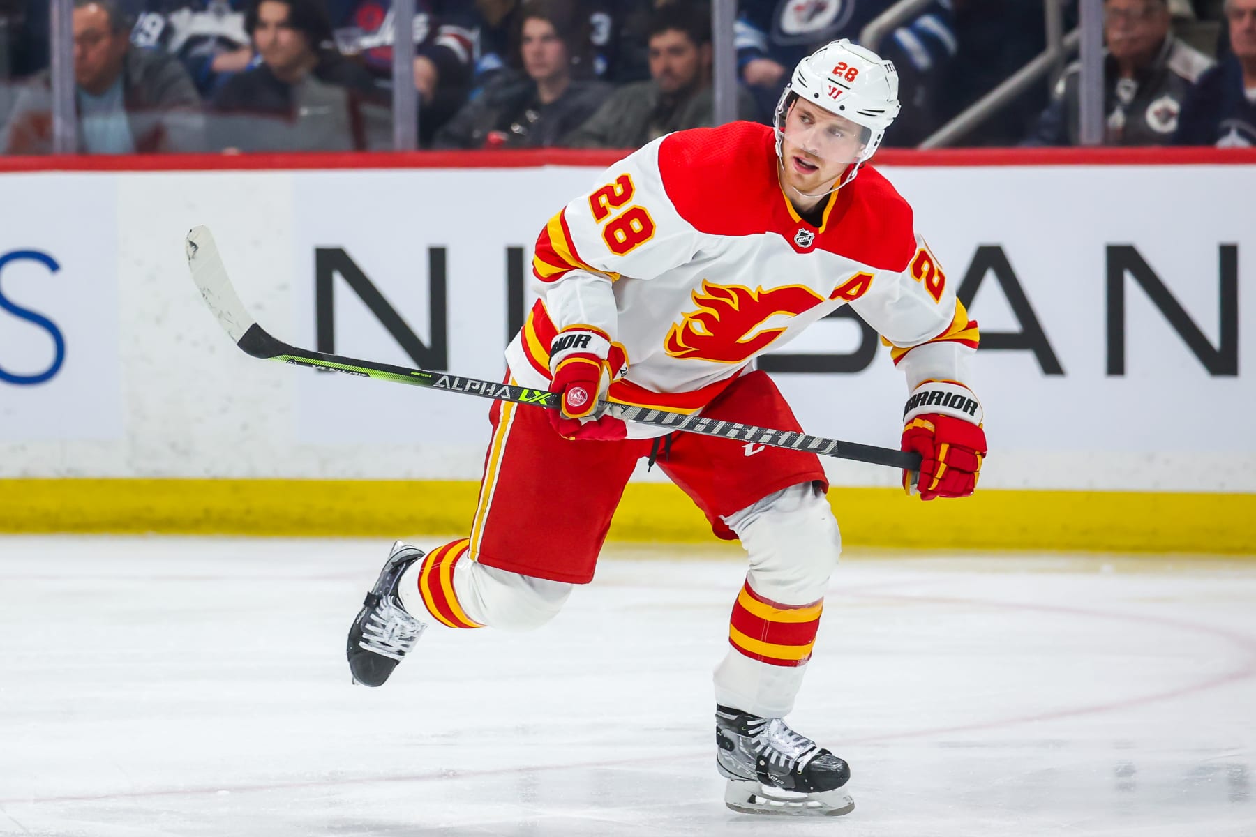 WINNIPEG, CANADA - APRIL 05: Elias Lindholm #28 of the Calgary Flames skates during third period action against the Winnipeg Jets at Canada Life Centre on April 05, 2023 in Winnipeg, Manitoba, Canada. (Photo by Jonathan Kozub/NHLI via Getty Images)