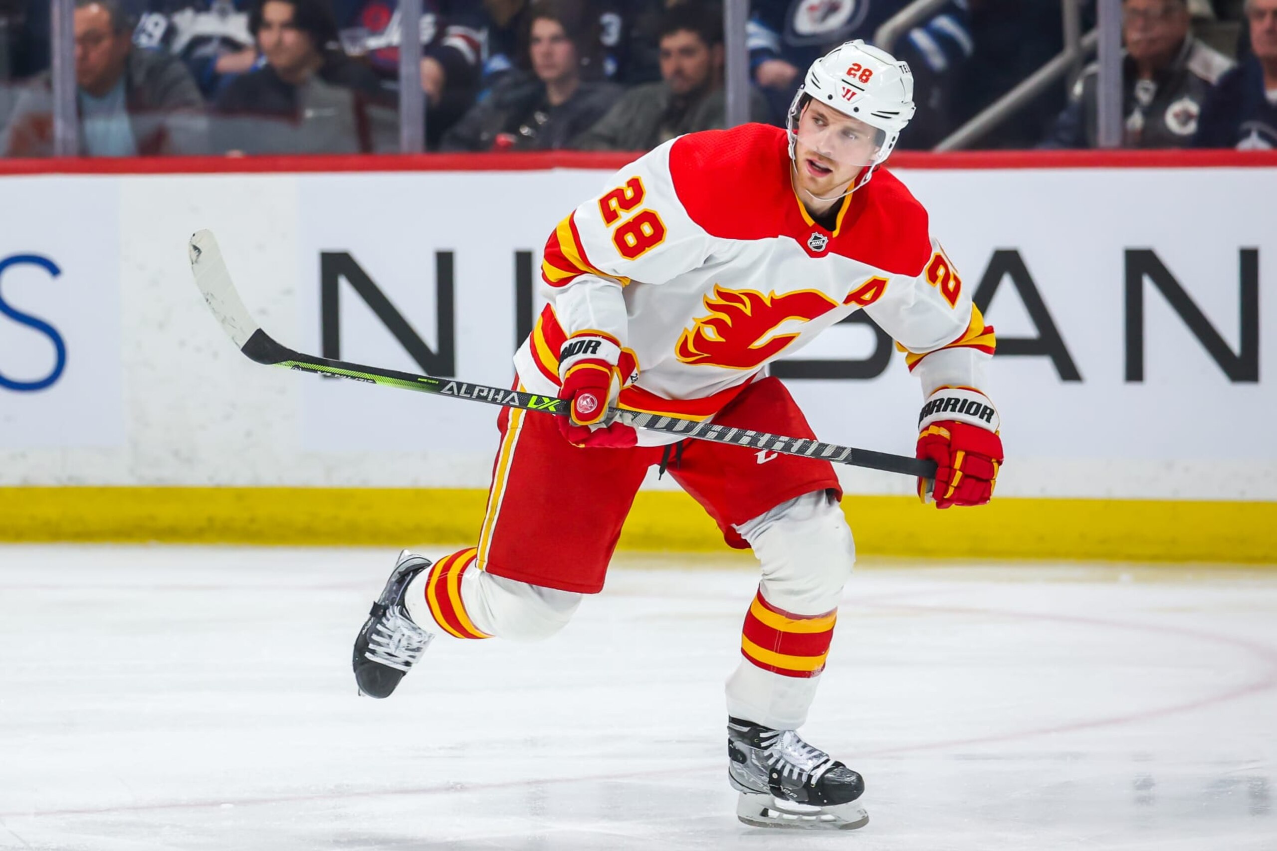 WINNIPEG, CANADA - APRIL 05: Elias Lindholm #28 of the Calgary Flames skates during third period action against the Winnipeg Jets at Canada Life Centre on April 05, 2023 in Winnipeg, Manitoba, Canada. (Photo by Jonathan Kozub/NHLI via Getty Images)