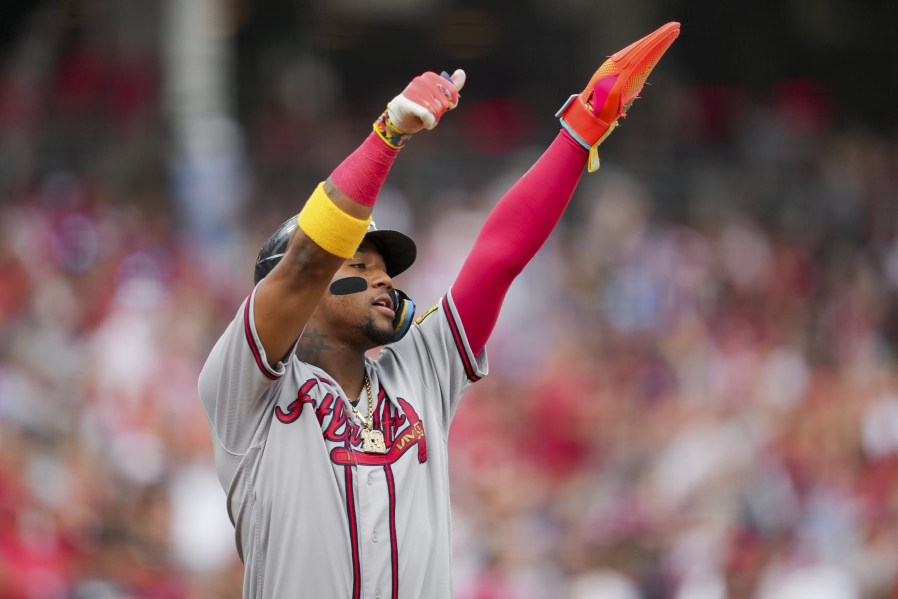 Atlanta Braves' Ronald Acuna Jr. reacts after scoring a run on a single by Austin Riley during the first inning of a baseball game against the Cincinnati Reds in Cincinnati, Friday, June 23, 2023. (AP Photo/Aaron Doster)