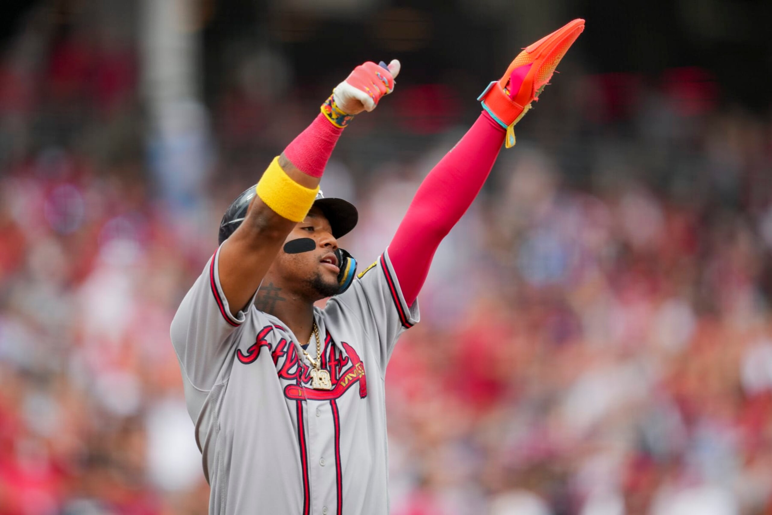 Atlanta Braves' Ronald Acuna Jr. reacts after scoring a run on a single by Austin Riley during the first inning of a baseball game against the Cincinnati Reds in Cincinnati, Friday, June 23, 2023. (AP Photo/Aaron Doster)