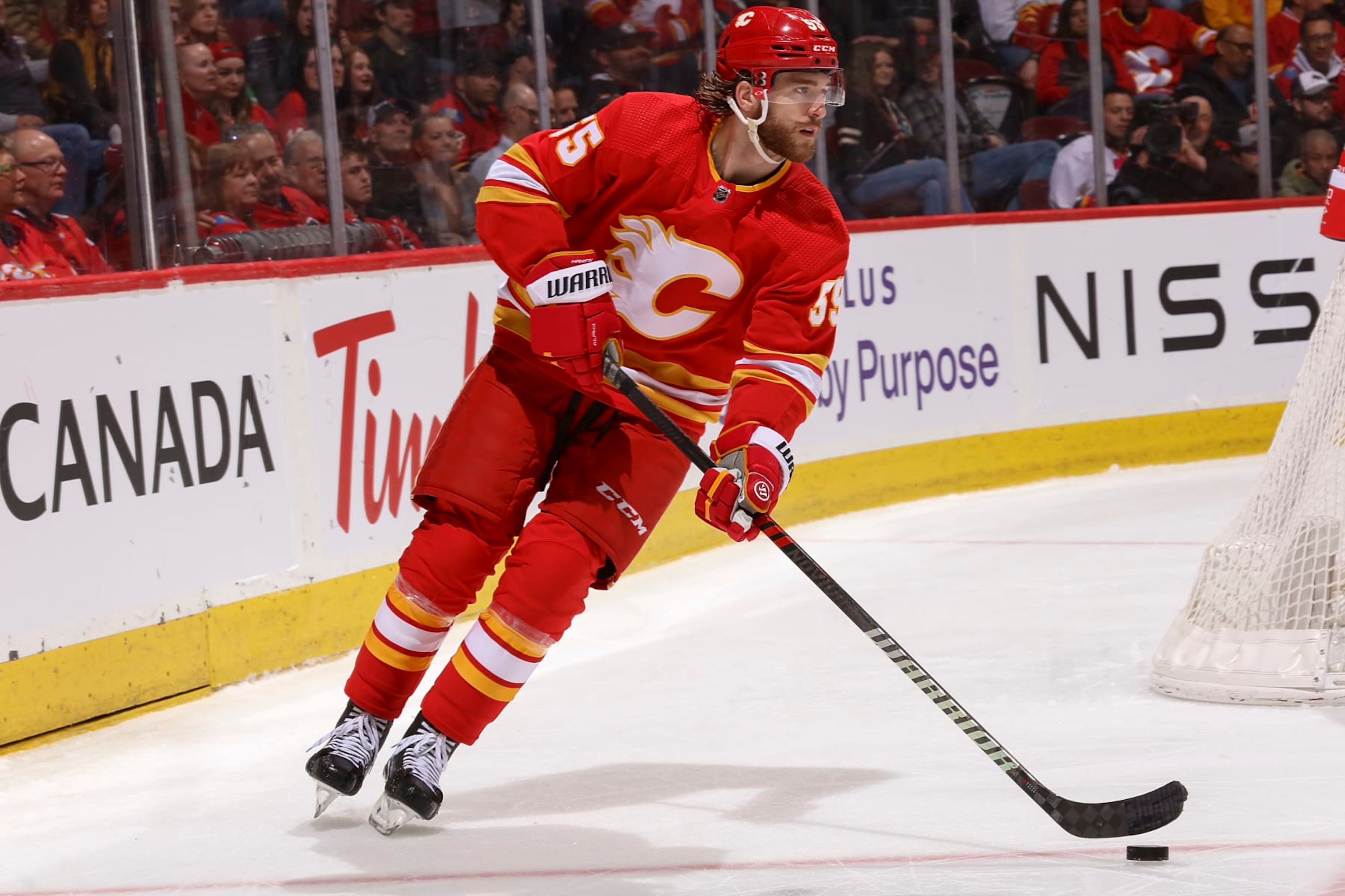 CALGARY, AB - APRIL 12: Noah Hanifin #55 of the Calgary Flames skates with the puck against the San Jose Sharks at Scotiabank Saddledome on April 12, 2023 in Calgary, Alberta, Canada. (Photo by Gerry Thomas/NHLI via Getty Images) CALGARY, AB - APRIL 12: Noah Hanifin #55 of the Calgary Flames skates with the puck against the San Jose Sharks at Scotiabank Saddledome on April 12, 2023 in Calgary, Alberta, Canada. (Photo by Gerry Thomas/NHLI via Getty Images)