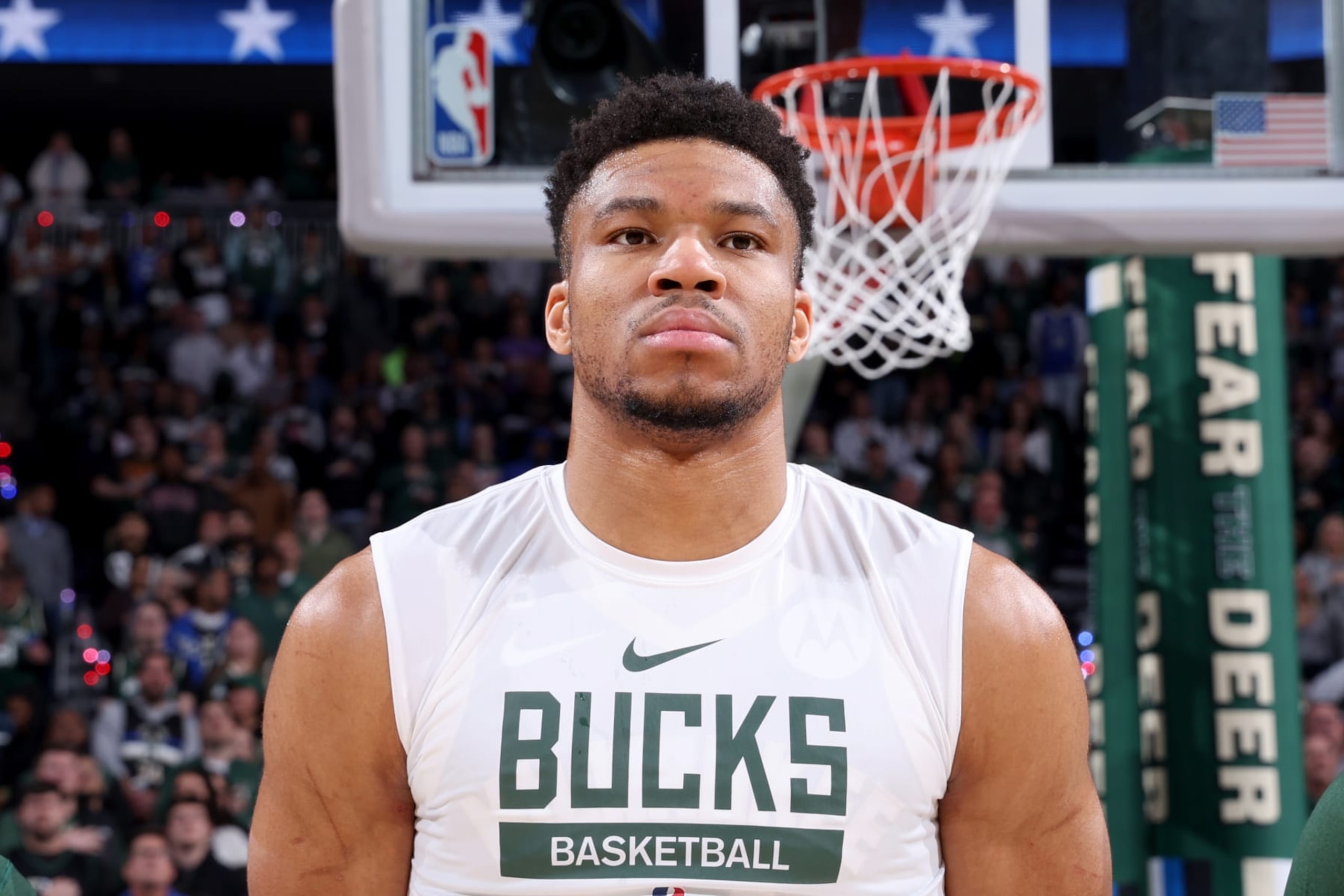 MILWAUKEE, WI - APRIL 26: Giannis Antetokounmpo #34 of the Milwaukee Bucks stands for the National Anthem before the game against the Miami Heat during Round 1 Game 5 of the 2023 NBA Playoffs on April 26, 2023 at the Fiserv Forum Center in Milwaukee, Wisconsin. NOTE TO USER: User expressly acknowledges and agrees that, by downloading and or using this Photograph, user is consenting to the terms and conditions of the Getty Images License Agreement. Mandatory Copyright Notice: Copyright 2023 NBAE (Photo by Jeff Haynes/NBAE via Getty Images).