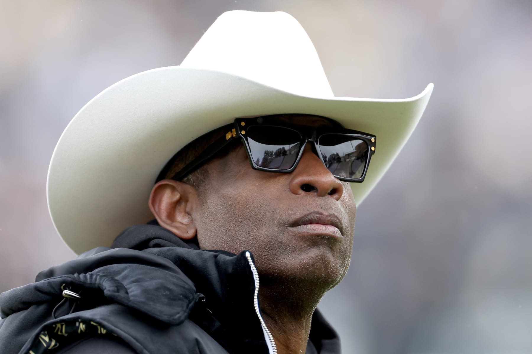 BOULDER, COLORADO - APRIL 22: Head coach Deion Sanders of the Colorado Buffaloes watches as his team warms up prior to their spring game at Folsom Field on April 22, 2023 in Boulder, Colorado. (Photo by Matthew Stockman/Getty Images)