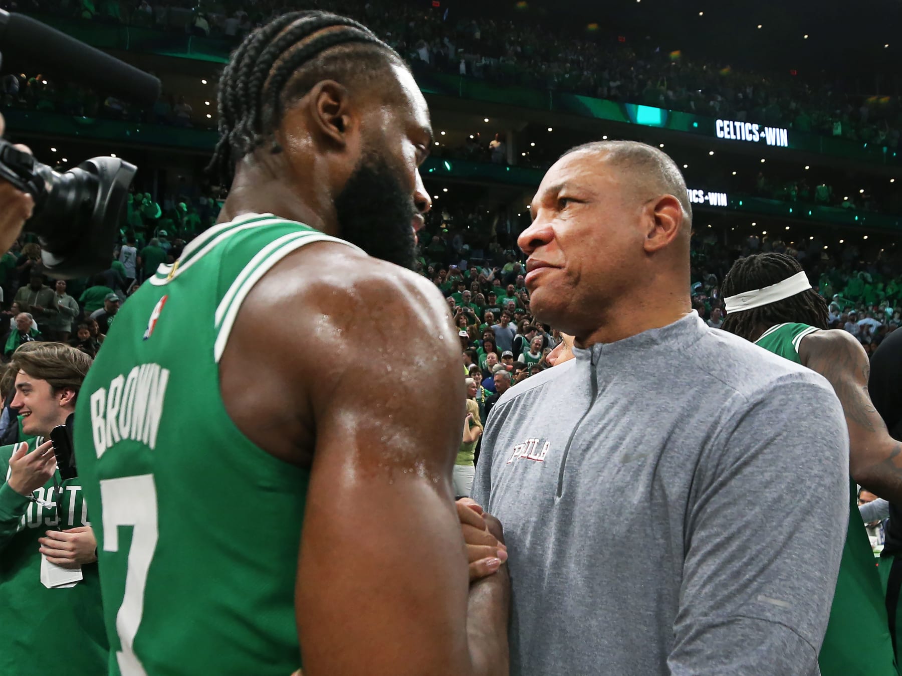 Boston, MA - May 14: Philadelphia 76ers head coach Doc Rivers and Boston Celtics SG Jaylen Brown embrace after the game. The Celtics beat the 76ers, 112-88, in Game 7 of the 2023 Eastern Conference Semifinals. (Photo by Jim Davis/The Boston Globe via Getty Images)