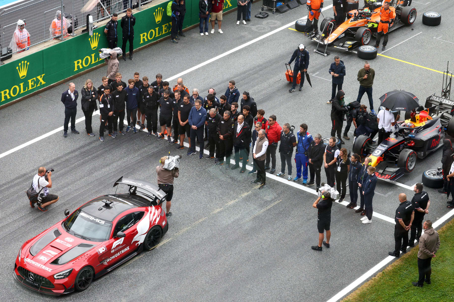 Formula One Group CEO Stefano Domenicali and others hold a moment of silence to honor Dilano van 't Hoff.
