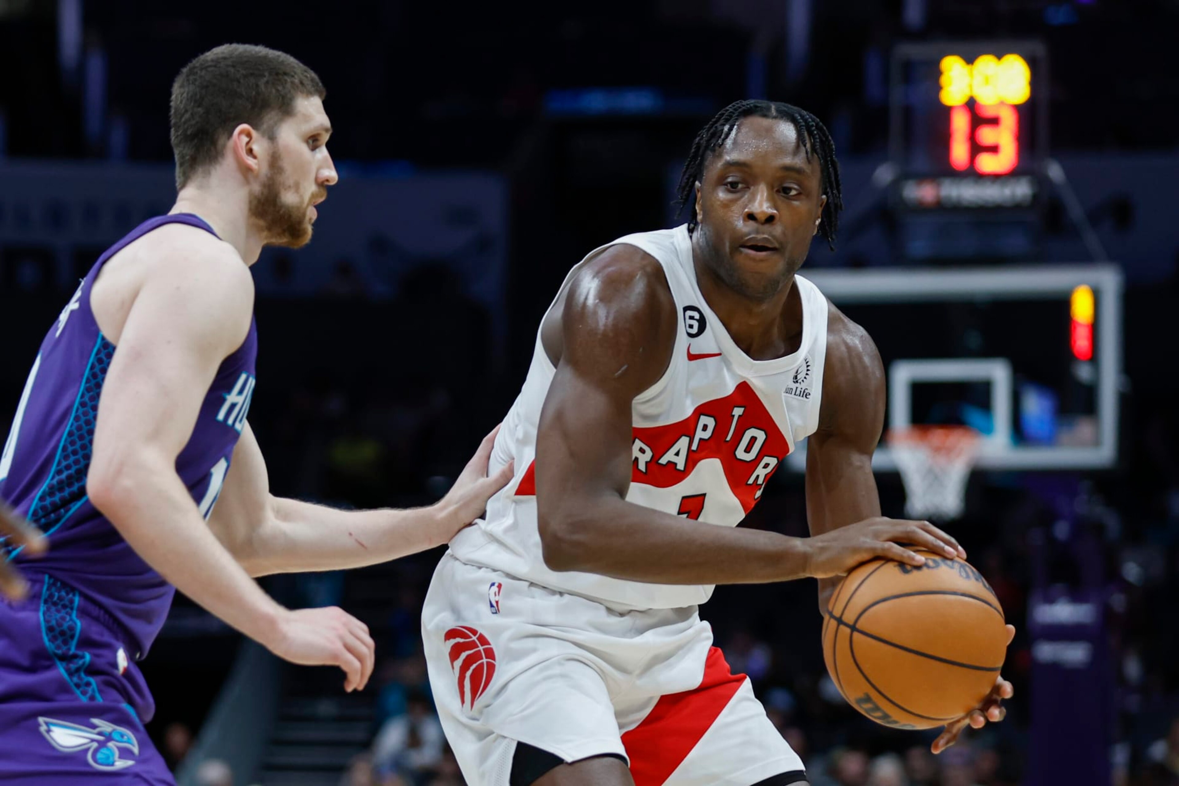 Toronto Raptors forward O.G. Anunoby, right, passes against Charlotte Hornets guard Svi Mykhailiuk during the second half of an NBA basketball game in Charlotte, N.C., Sunday, April 2, 2023. Toronto won 128-108. (AP Photo/Nell Redmond) Toronto Raptors forward O.G. Anunoby, right, passes against Charlotte Hornets guard Svi Mykhailiuk during the second half of an NBA basketball game in Charlotte, N.C., Sunday, April 2, 2023. Toronto won 128-108. (AP Photo/Nell Redmond)
