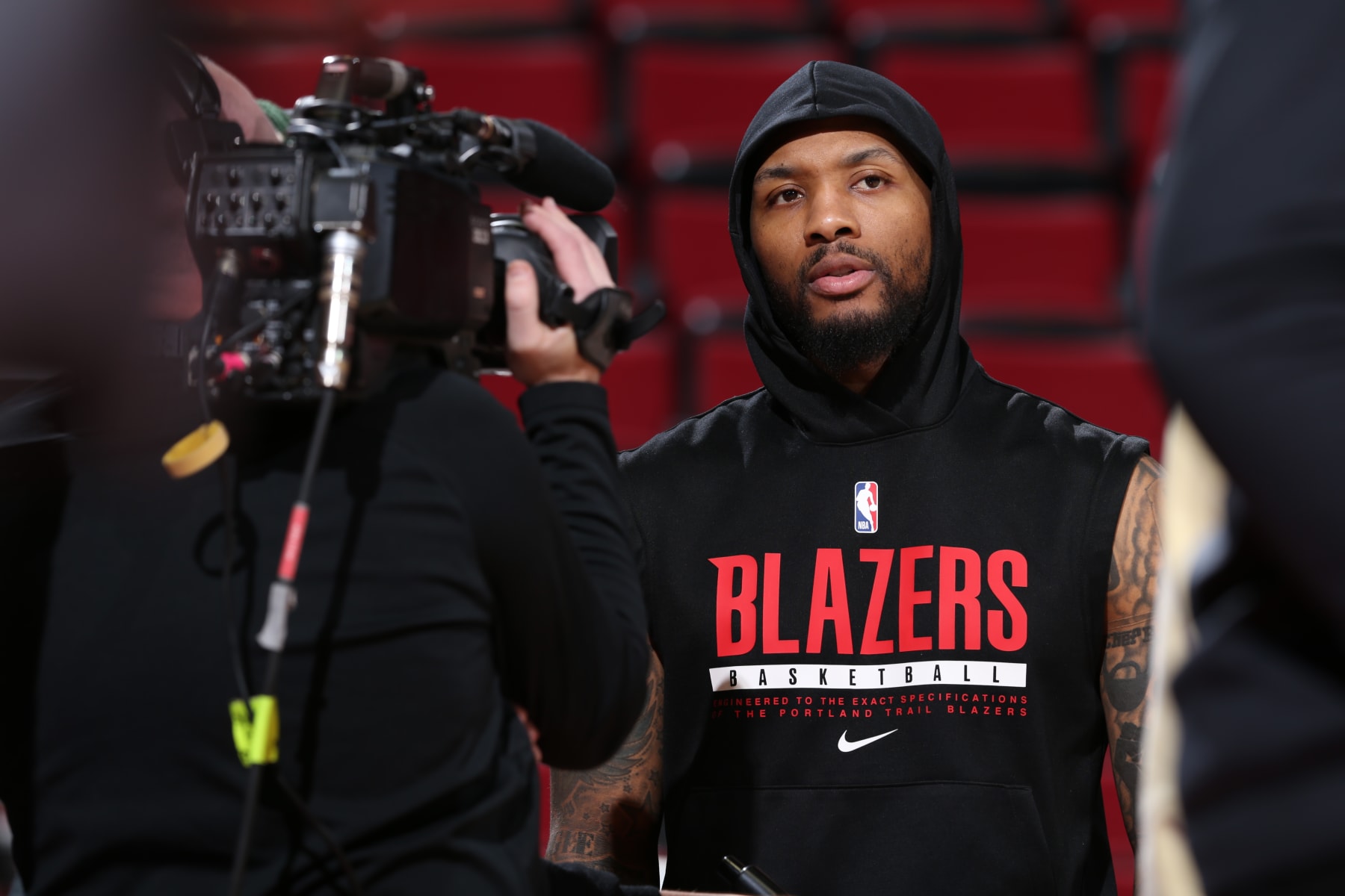 PORTLAND, OR - MARCH 19: Damian Lillard #0 of the Portland Trail Blazers is interviewed before the game against the LA Clippers on March 19, 2023 at the Moda Center Arena in Portland, Oregon. NOTE TO USER: User expressly acknowledges and agrees that, by downloading and or using this photograph, user is consenting to the terms and conditions of the Getty Images License Agreement. Mandatory Copyright Notice: Copyright 2023 NBAE (Photo by Sam Forencich/NBAE via Getty Images)