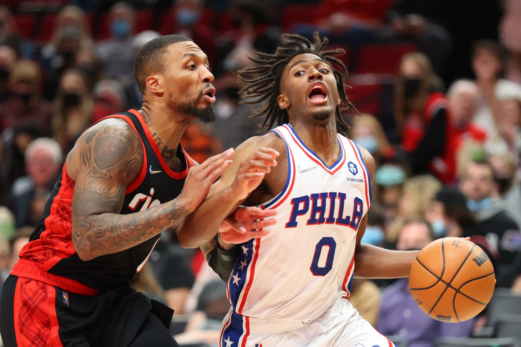PORTLAND, OREGON - NOVEMBER 20: Tyrese Maxey #0 of the Philadelphia 76ers works towards the basket against Damian Lillard #0 of the Portland Trail Blazers during the third quarter at Moda Center on November 20, 2021 in Portland, Oregon. NOTE TO USER: User expressly acknowledges and agrees that, by downloading and or using this photograph, User is consenting to the terms and conditions of the Getty Images License Agreement.  (Photo by Abbie Parr/Getty Images)