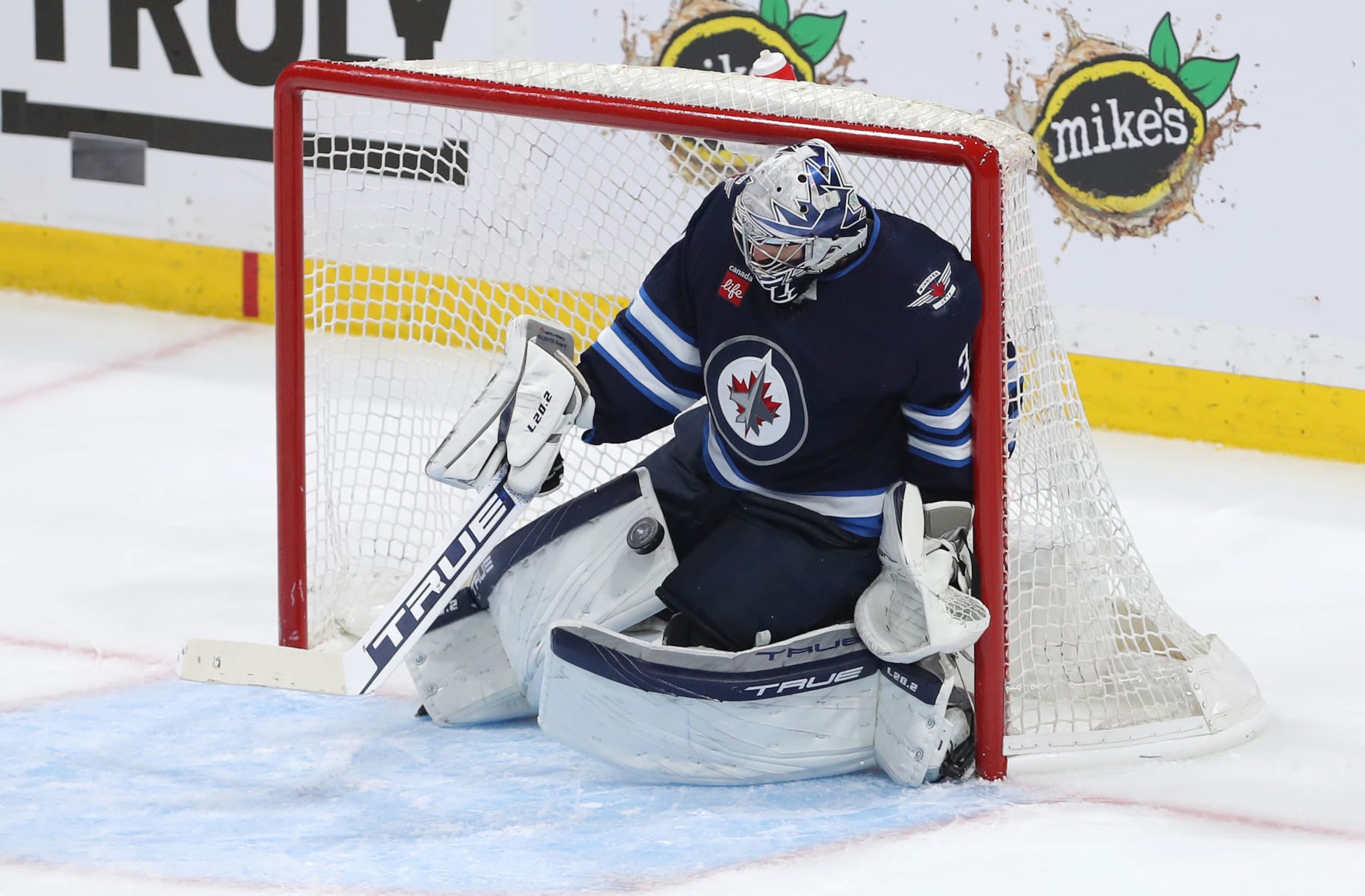 WINNIPEG, CANADA - APRIL 24: Connor Hellebuyck #37 of the Winnipeg Jets makes a save during action against the Vegas Golden Knights in the third period of Game Four of the First Round of the 2023 Stanley Cup Playoffs on April 24, 2023 at Canada Life Centre in Winnipeg, Manitoba, Canada. (Photo by Jason Halstead/Getty Images) WINNIPEG, CANADA - APRIL 24: Connor Hellebuyck #37 of the Winnipeg Jets makes a save during action against the Vegas Golden Knights in the third period of Game Four of the First Round of the 2023 Stanley Cup Playoffs on April 24, 2023 at Canada Life Centre in Winnipeg, Manitoba, Canada. (Photo by Jason Halstead/Getty Images)