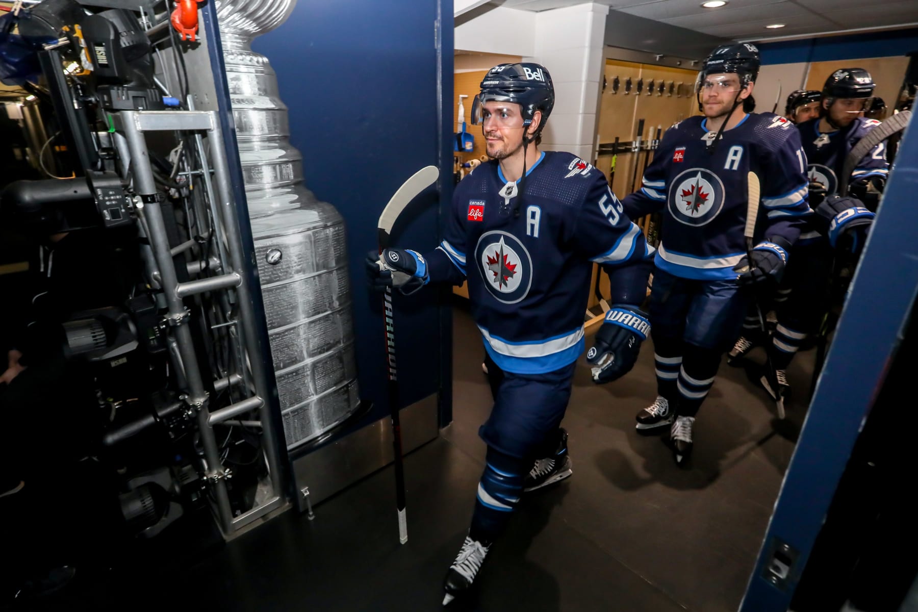 WINNIPEG, CANADA - APRIL 24: Mark Scheifele #55 of the Winnipeg Jets gets set to lead teammates to the ice for the pre-game warm up prior to NHL action against the Vegas Golden Knights in Game Four of the First Round of the 2023 Stanley Cup Playoffs at the Canada Life Centre on April 24, 2023 in Winnipeg, Manitoba, Canada. (Photo by Jonathan Kozub/NHLI via Getty Images)