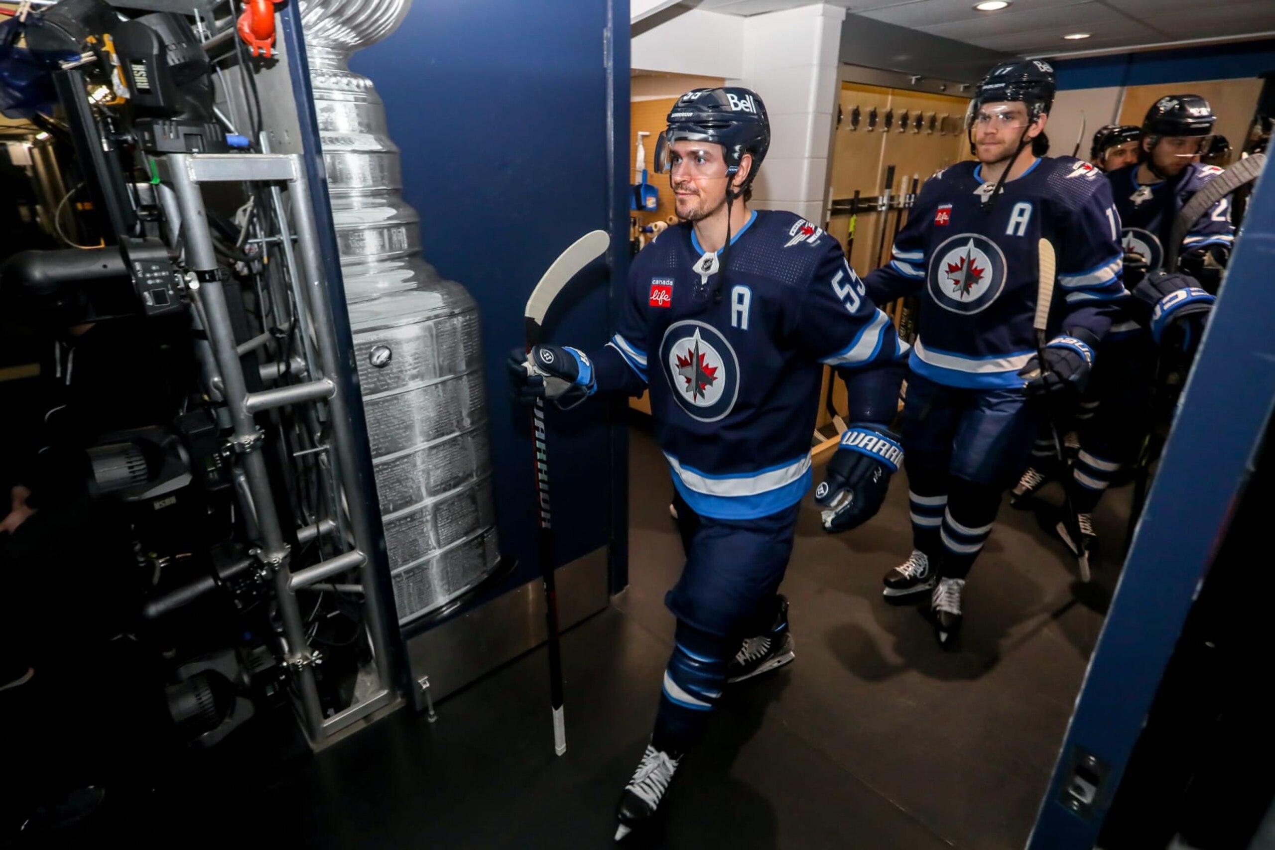 WINNIPEG, CANADA - APRIL 24: Mark Scheifele #55 of the Winnipeg Jets gets set to lead teammates to the ice for the pre-game warm up prior to NHL action against the Vegas Golden Knights in Game Four of the First Round of the 2023 Stanley Cup Playoffs at the Canada Life Centre on April 24, 2023 in Winnipeg, Manitoba, Canada. (Photo by Jonathan Kozub/NHLI via Getty Images) WINNIPEG, CANADA - APRIL 24: Mark Scheifele #55 of the Winnipeg Jets gets set to lead teammates to the ice for the pre-game warm up prior to NHL action against the Vegas Golden Knights in Game Four of the First Round of the 2023 Stanley Cup Playoffs at the Canada Life Centre on April 24, 2023 in Winnipeg, Manitoba, Canada. (Photo by Jonathan Kozub/NHLI via Getty Images)