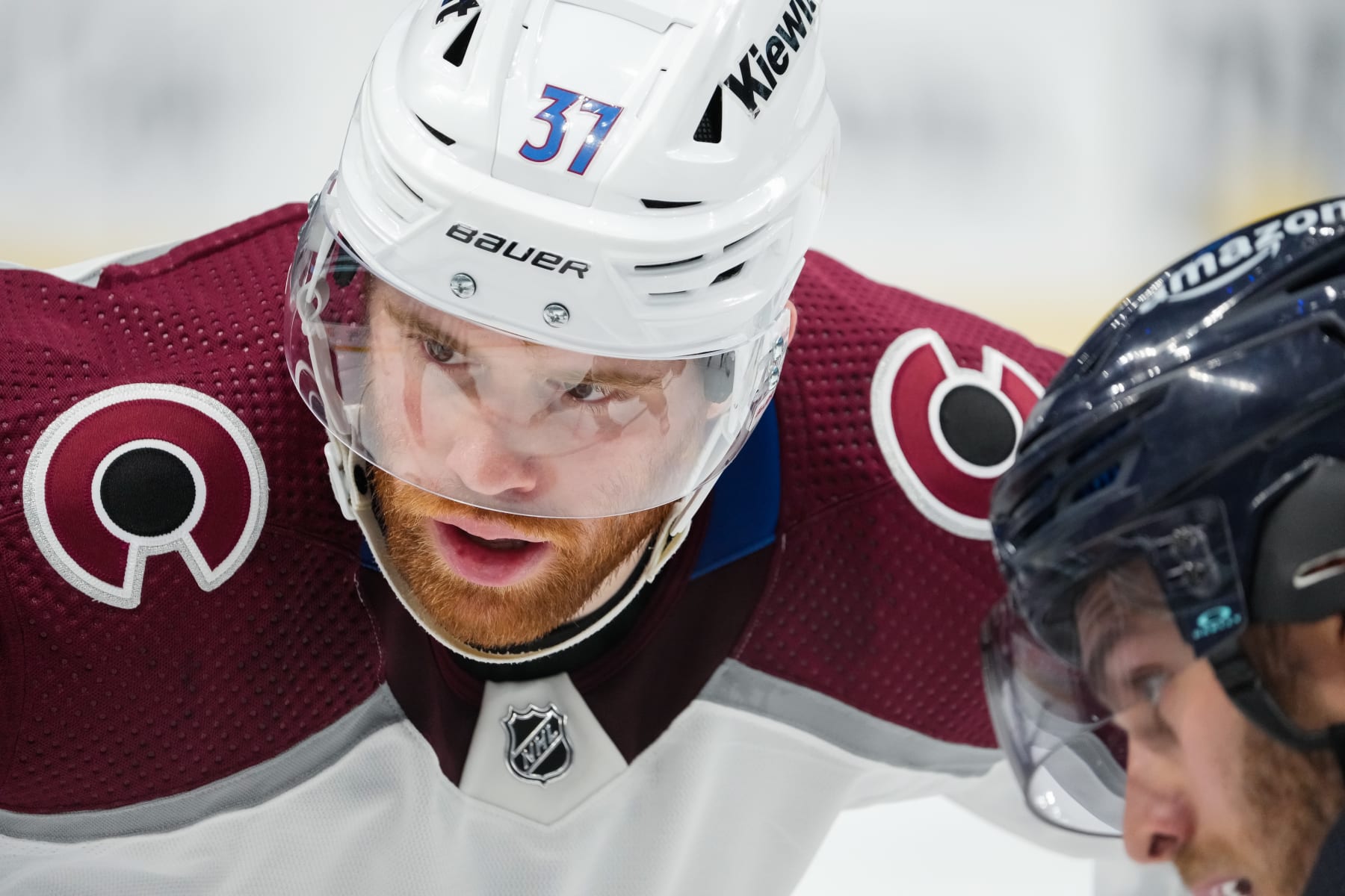 SEATTLE, WASHINGTON - APRIL 24: J.T. Compher #37 of the Colorado Avalanche and Alex Wennberg #21 of the Seattle Kraken prepare to faceoff against each other in Game Four of the First Round of the 2023 Stanley Cup Playoffs at Climate Pledge Arena on April 24, 2023 in Seattle, Washington. (Photo by Christopher Mast/NHLI via Getty Images)