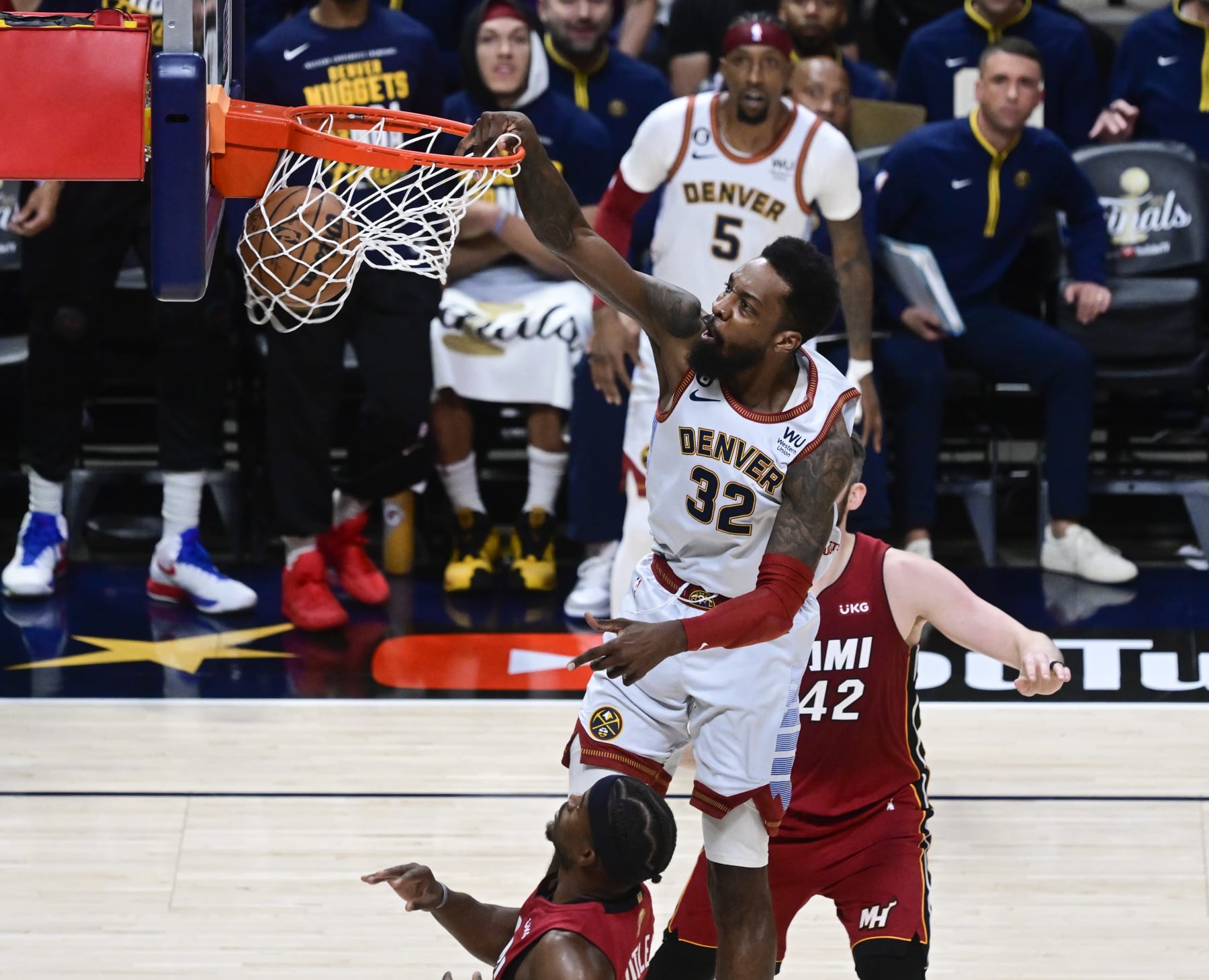 DENVER, CO - JUNE 12: Jeff Green (32) of the Denver Nuggets slam dunks over Jimmy Butler (22) of the Miami Heat in the first quarter during Game 5 of the NBA Finals at Ball Arena June 12, 2023. (Photo by Andy Cross/MediaNews Group/The Denver Post via Getty Images)