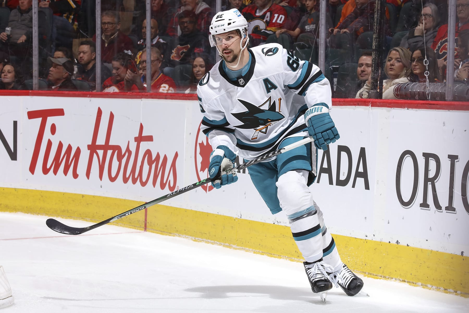 CALGARY, AB - APRIL 12: Erik Karlsson #65 of the San Jose Sharks skates up ice against the Calgary Flames at Scotiabank Saddledome on April 12, 2023 in Calgary, Alberta, Canada. (Photo by Gerry Thomas/NHLI via Getty Images) CALGARY, AB - APRIL 12: Erik Karlsson #65 of the San Jose Sharks skates up ice against the Calgary Flames at Scotiabank Saddledome on April 12, 2023 in Calgary, Alberta, Canada. (Photo by Gerry Thomas/NHLI via Getty Images)