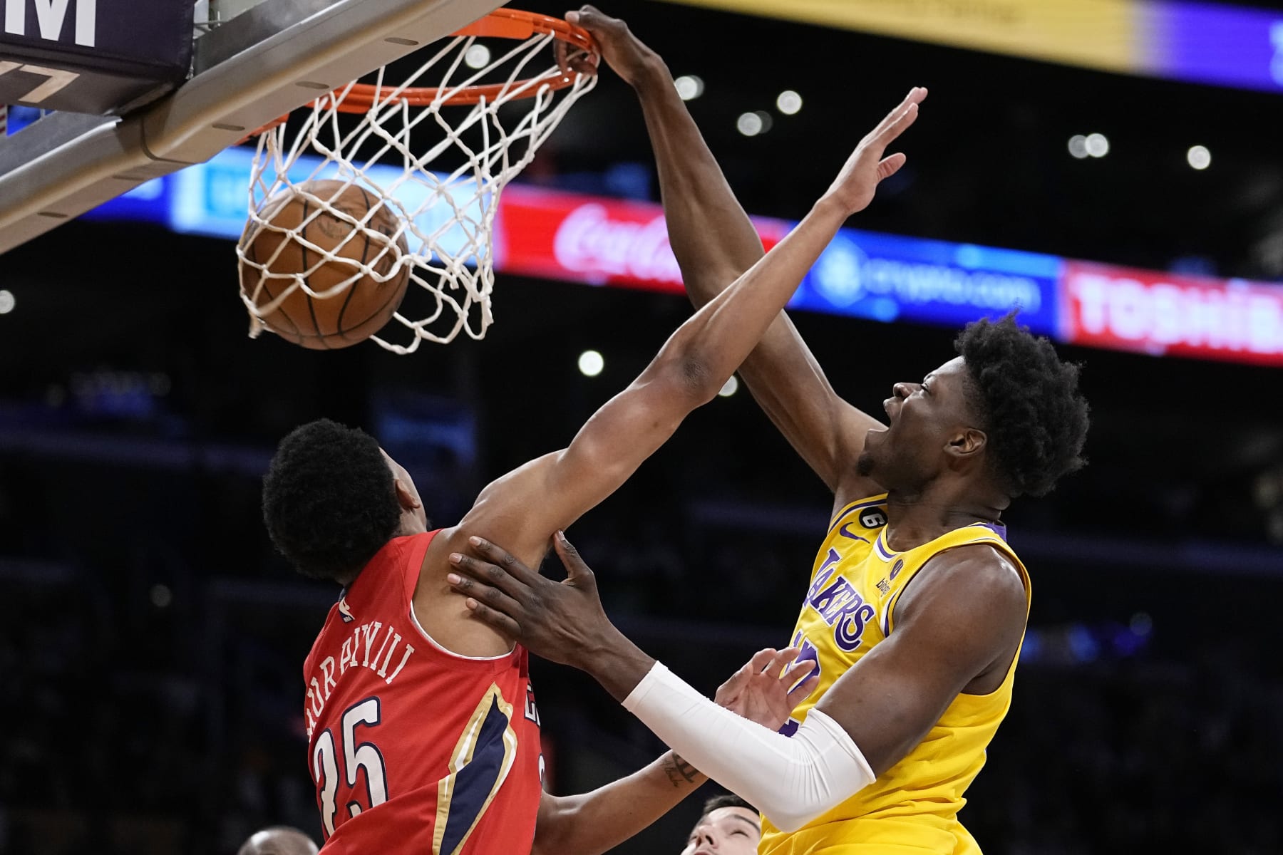 Los Angeles Lakers center Mo Bamba, right, dunks as New Orleans Pelicans guard Trey Murphy III defends during the second half of an NBA basketball game Wednesday, Feb. 15, 2023, in Los Angeles. (AP Photo/Mark J. Terrill)