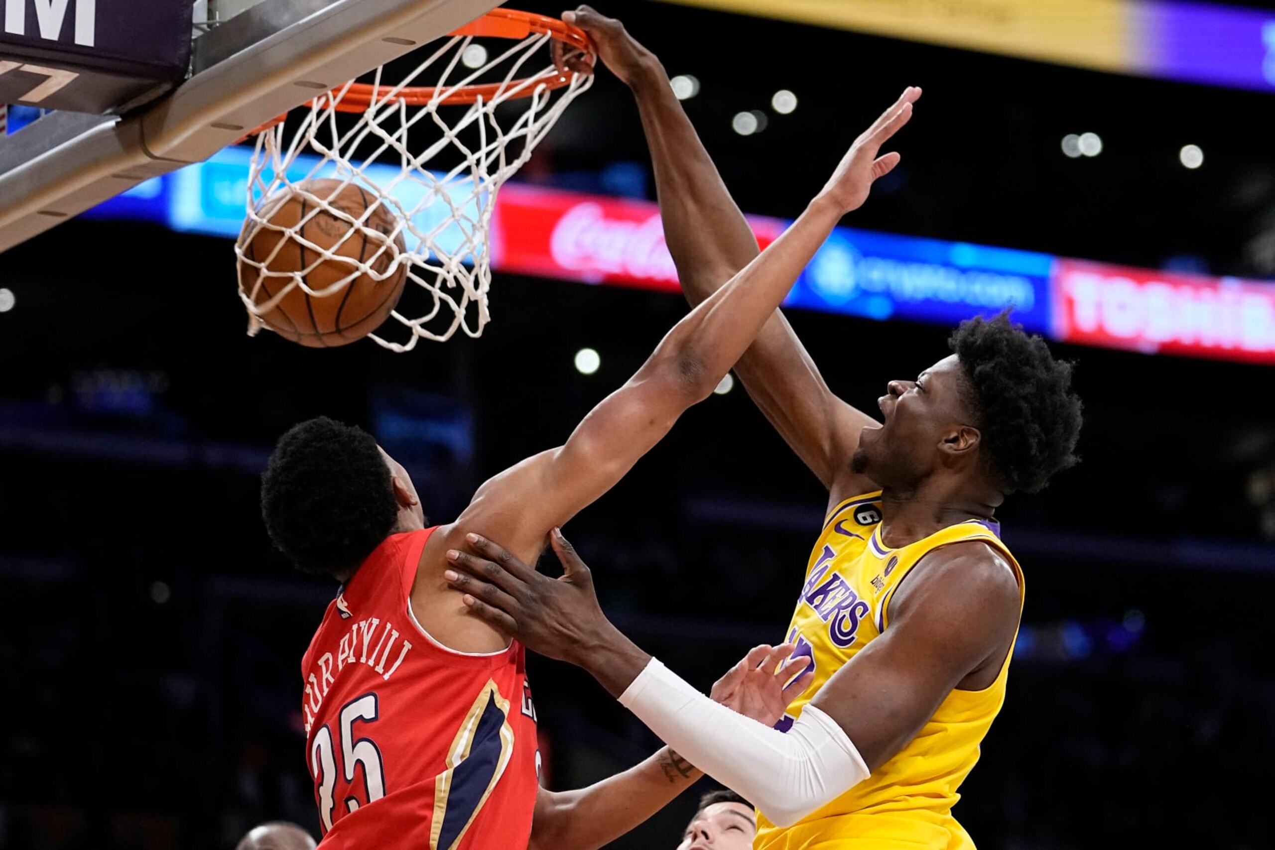 Los Angeles Lakers center Mo Bamba, right, dunks as New Orleans Pelicans guard Trey Murphy III defends during the second half of an NBA basketball game Wednesday, Feb. 15, 2023, in Los Angeles. (AP Photo/Mark J. Terrill) Los Angeles Lakers center Mo Bamba, right, dunks as New Orleans Pelicans guard Trey Murphy III defends during the second half of an NBA basketball game Wednesday, Feb. 15, 2023, in Los Angeles. (AP Photo/Mark J. Terrill)