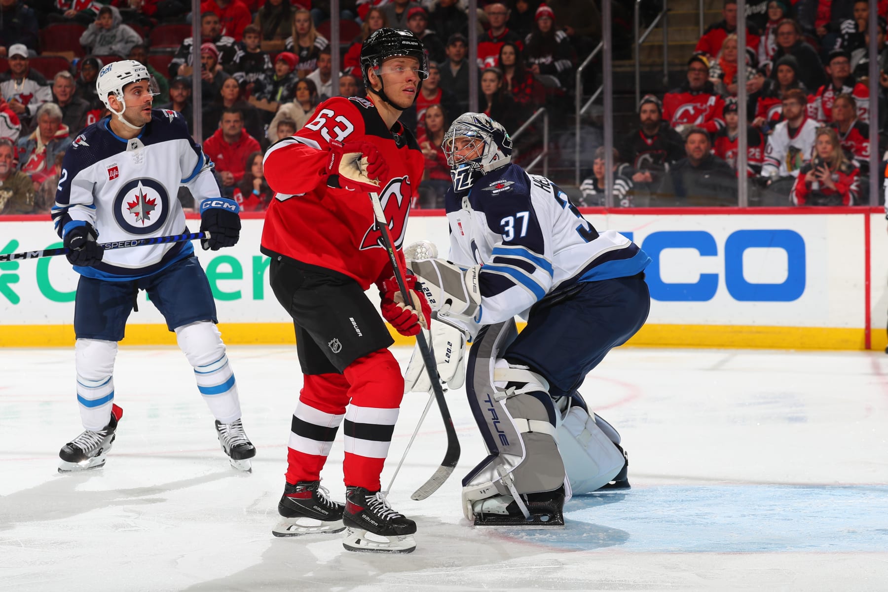 NEWARK, NJ - FEBRUARY 19: Connor Hellebuyck #37 of the Winnipeg Jets defends his net in the first period of the game against the New Jersey Devils on February 19, 2023 at the Prudential Center in Newark, New Jersey. (Photo by Rich Graessle/NHLI via Getty Images) NEWARK, NJ - FEBRUARY 19: Connor Hellebuyck #37 of the Winnipeg Jets defends his net in the first period of the game against the New Jersey Devils on February 19, 2023 at the Prudential Center in Newark, New Jersey. (Photo by Rich Graessle/NHLI via Getty Images)