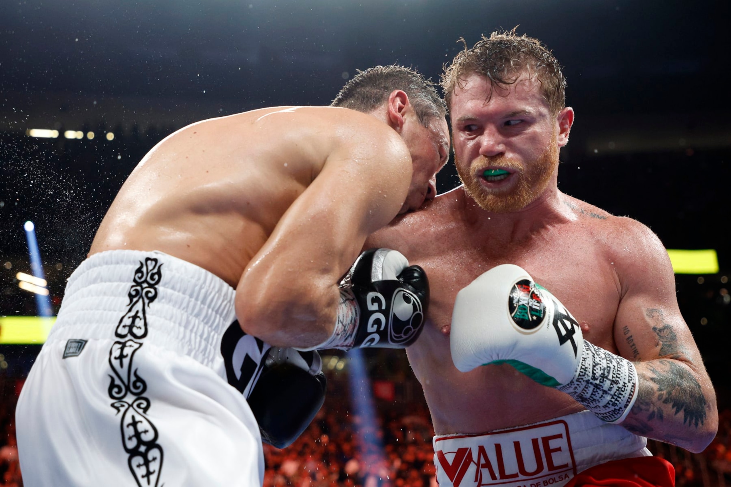 LAS VEGAS, NEVADA - SEPTEMBER 17: Canelo Alvarez (red trunks) lands a punch against Gennadiy Golovkin (white trunks) in round twelve of the fight for the Super Middleweight Title at T-Mobile Arena on September 17, 2022 in Las Vegas, Nevada. (Photo by Sarah Stier/Getty Images)