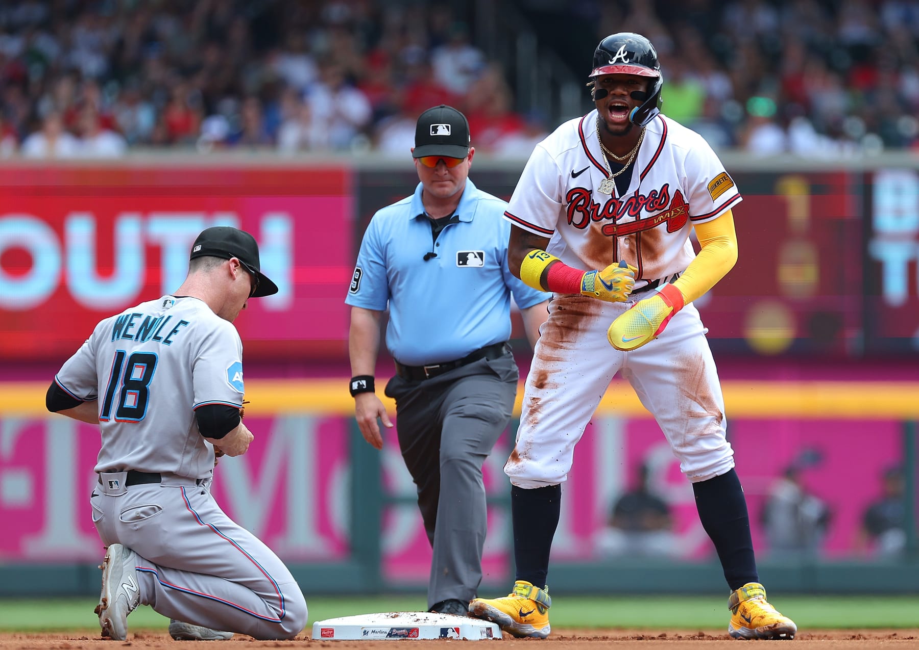 ATLANTA, GEORGIA - JULY 02:  Ronald Acuna Jr. #13 of the Atlanta Braves reacts after his 38th stolen base in the first inning against Joey Wendle #18 of the Miami Marlins at Truist Park on July 02, 2023 in Atlanta, Georgia. (Photo by Kevin C. Cox/Getty Images)