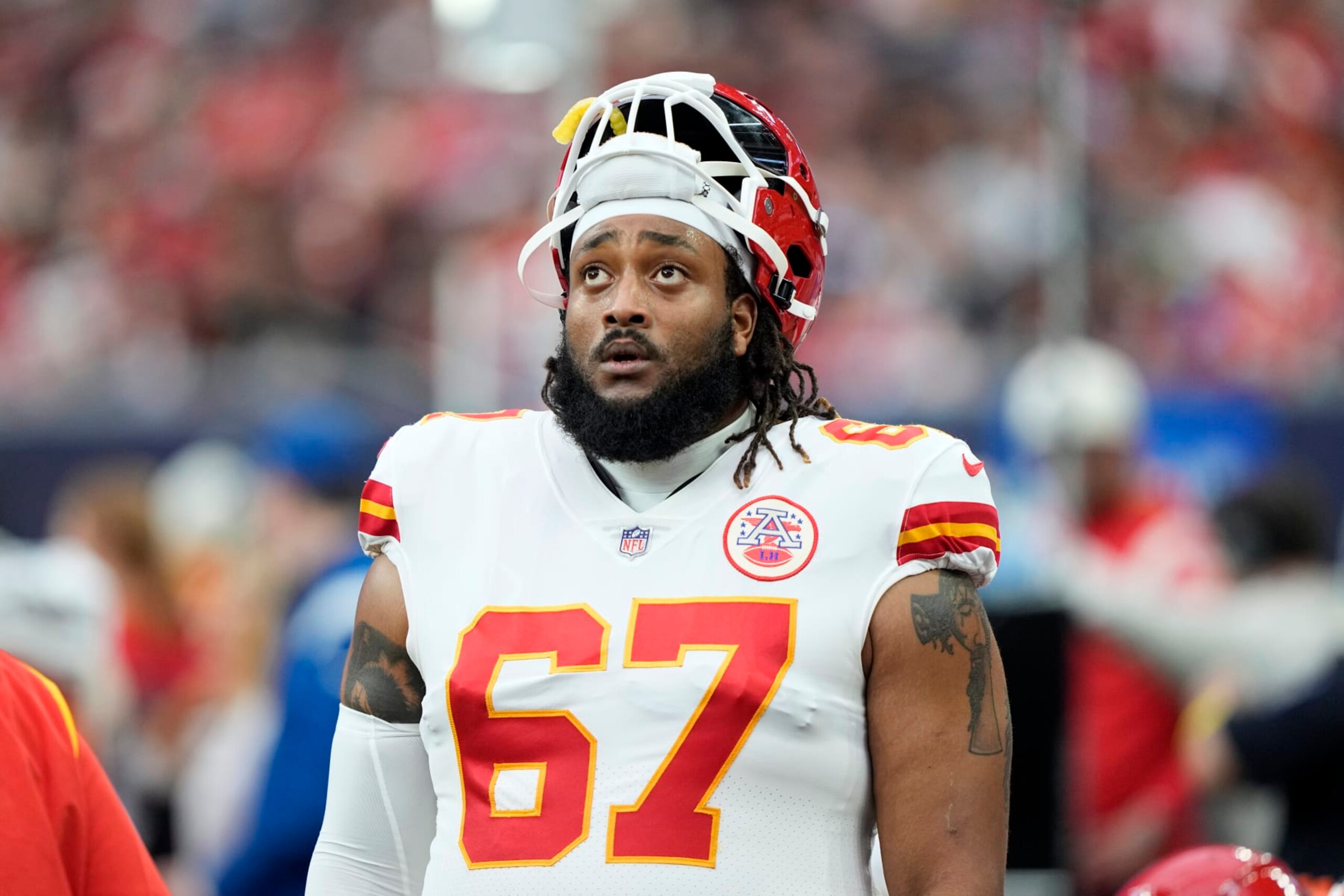 Kansas City Chiefs offensive tackle Lucas Niang looks up at the scoreboard during the second half of an NFL football game against the Houston Texans Sunday, Dec. 18, 2022, in Houston. The Chiefs won 30-24 in overtime. (AP Photo/David J. Phillip)