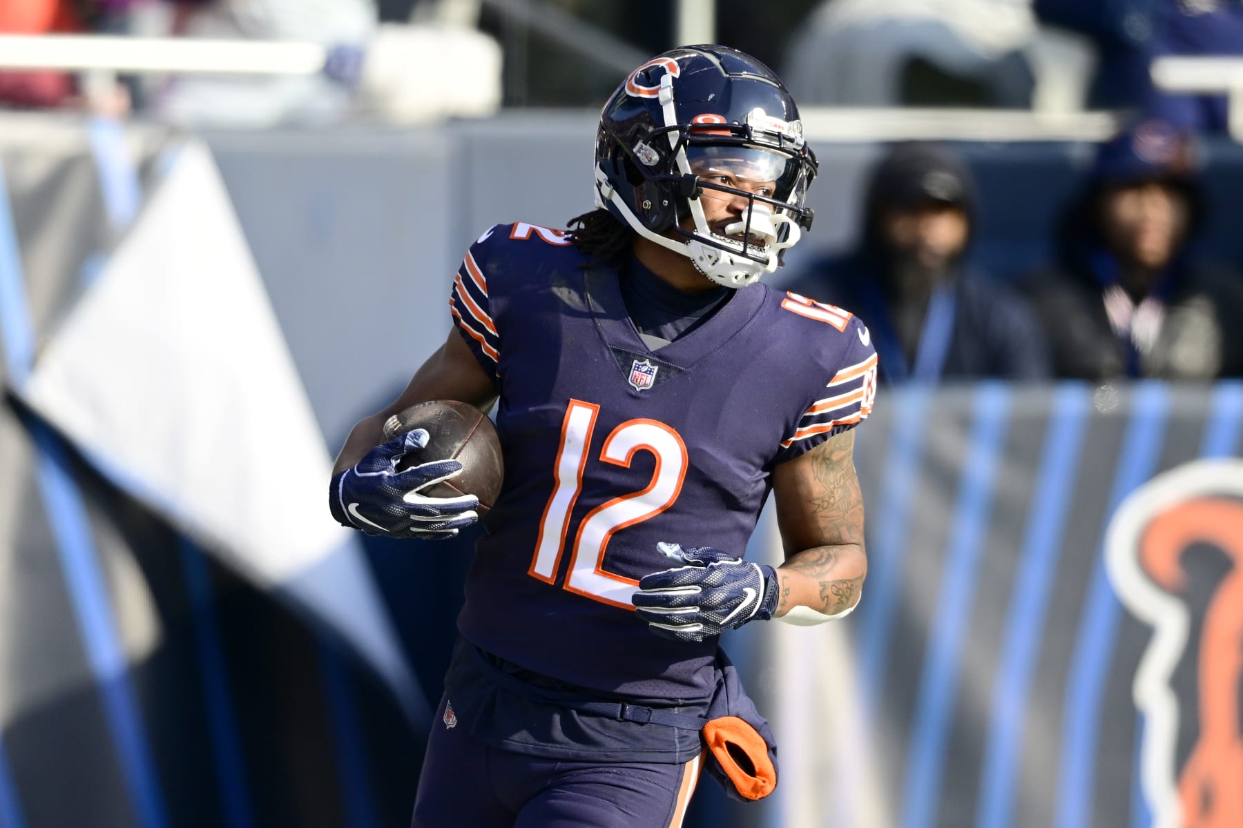 CHICAGO, ILLINOIS - JANUARY 08: Velus Jones Jr. #12 of the Chicago Bears reacts after scoring a touchdown in the second quarter of a game against the Minnesota Vikings at Soldier Field on January 08, 2023 in Chicago, Illinois. (Photo by Quinn Harris/Getty Images)