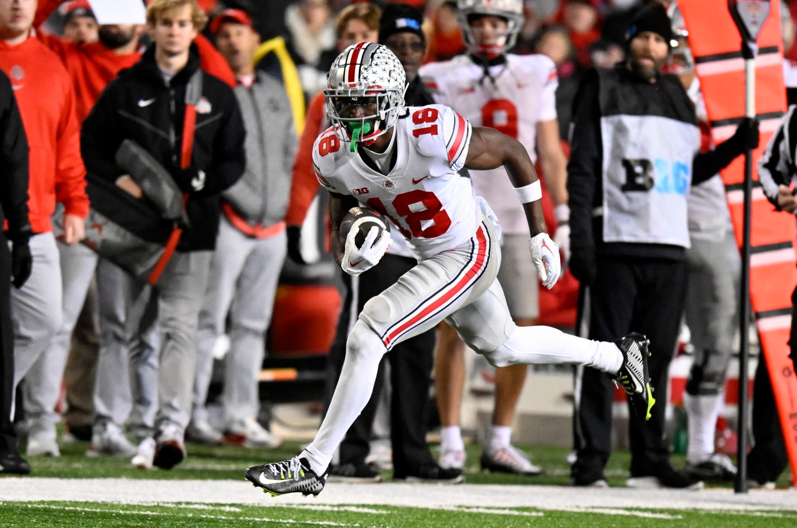 COLLEGE PARK, MARYLAND - NOVEMBER 19: Marvin Harrison Jr. #18 of the Ohio State Buckeyes runs with the ball after a catch against the Maryland Terrapins at SECU Stadium on November 19, 2022 in College Park, Maryland. (Photo by G Fiume/Getty Images)