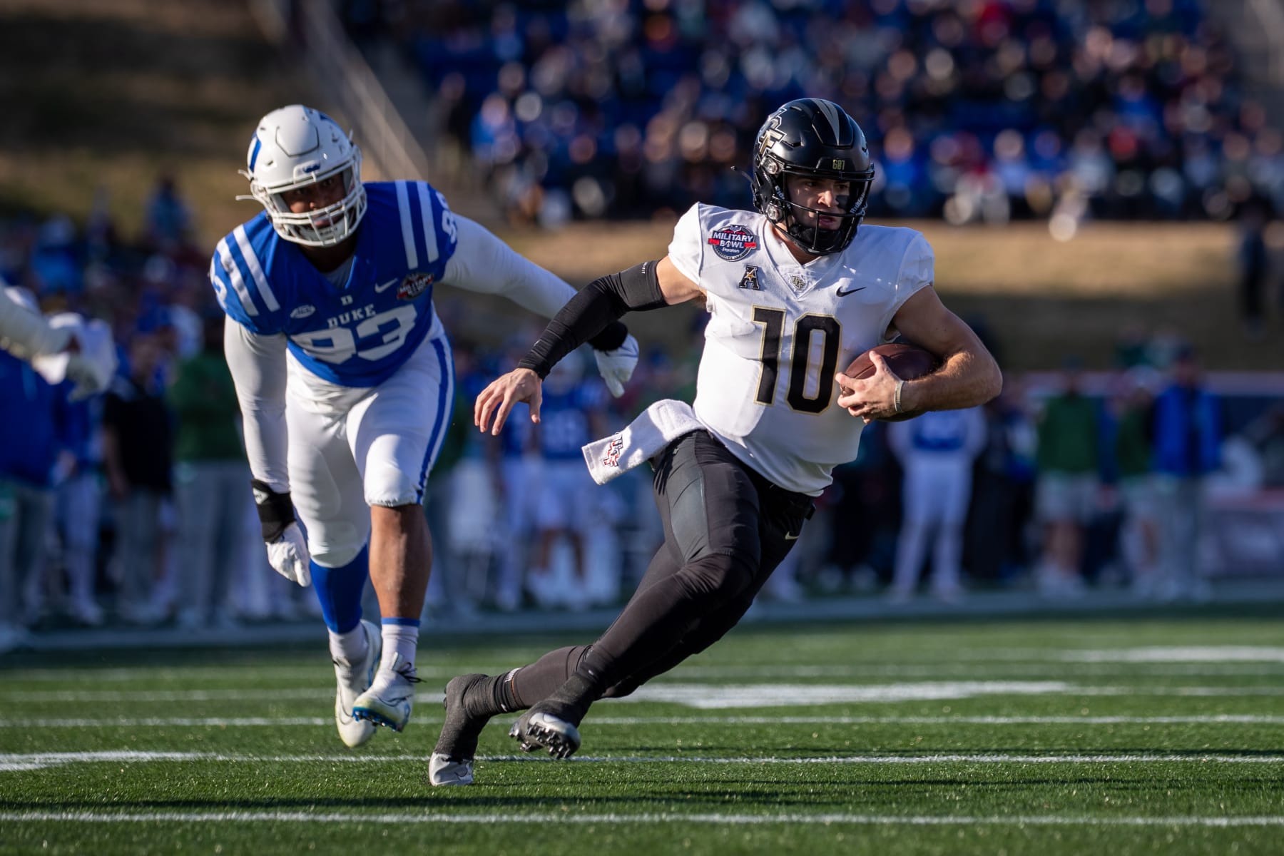 ANNAPOLIS, MD - DECEMBER 28: UCF Knights quarterback John Rhys Plumlee (10) scrambles for a first down during the Military Bowl between the UCF Knights and the Duke Blue Devils on December 28, 2022 at Navy-Marine Corps Memorial Stadium in Annapolis, MD. (Photo by Charles Brock/Icon Sportswire via Getty Images)