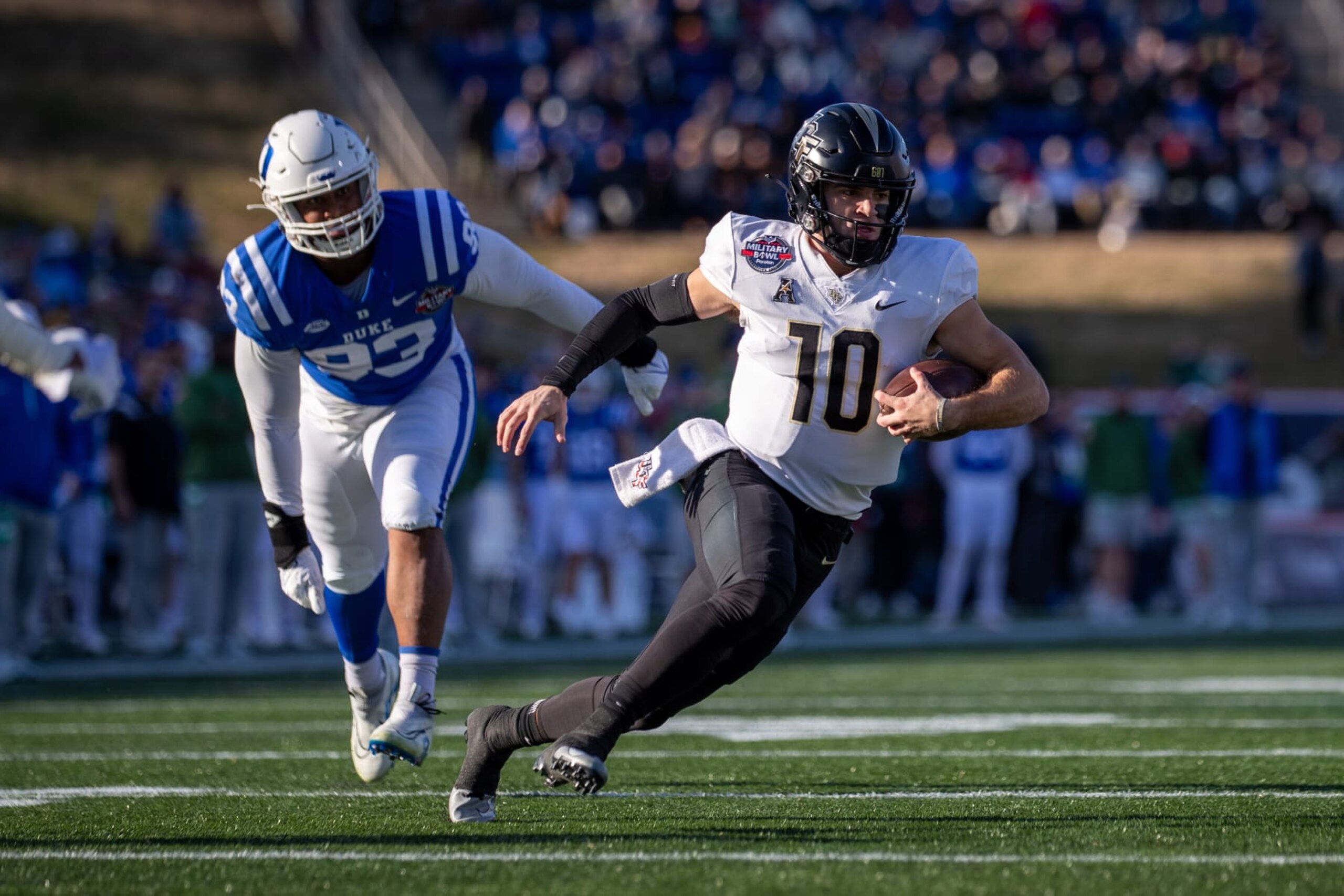 ANNAPOLIS, MD - DECEMBER 28: UCF Knights quarterback John Rhys Plumlee (10) scrambles for a first down during the Military Bowl between the UCF Knights and the Duke Blue Devils on December 28, 2022 at Navy-Marine Corps Memorial Stadium in Annapolis, MD. (Photo by Charles Brock/Icon Sportswire via Getty Images)