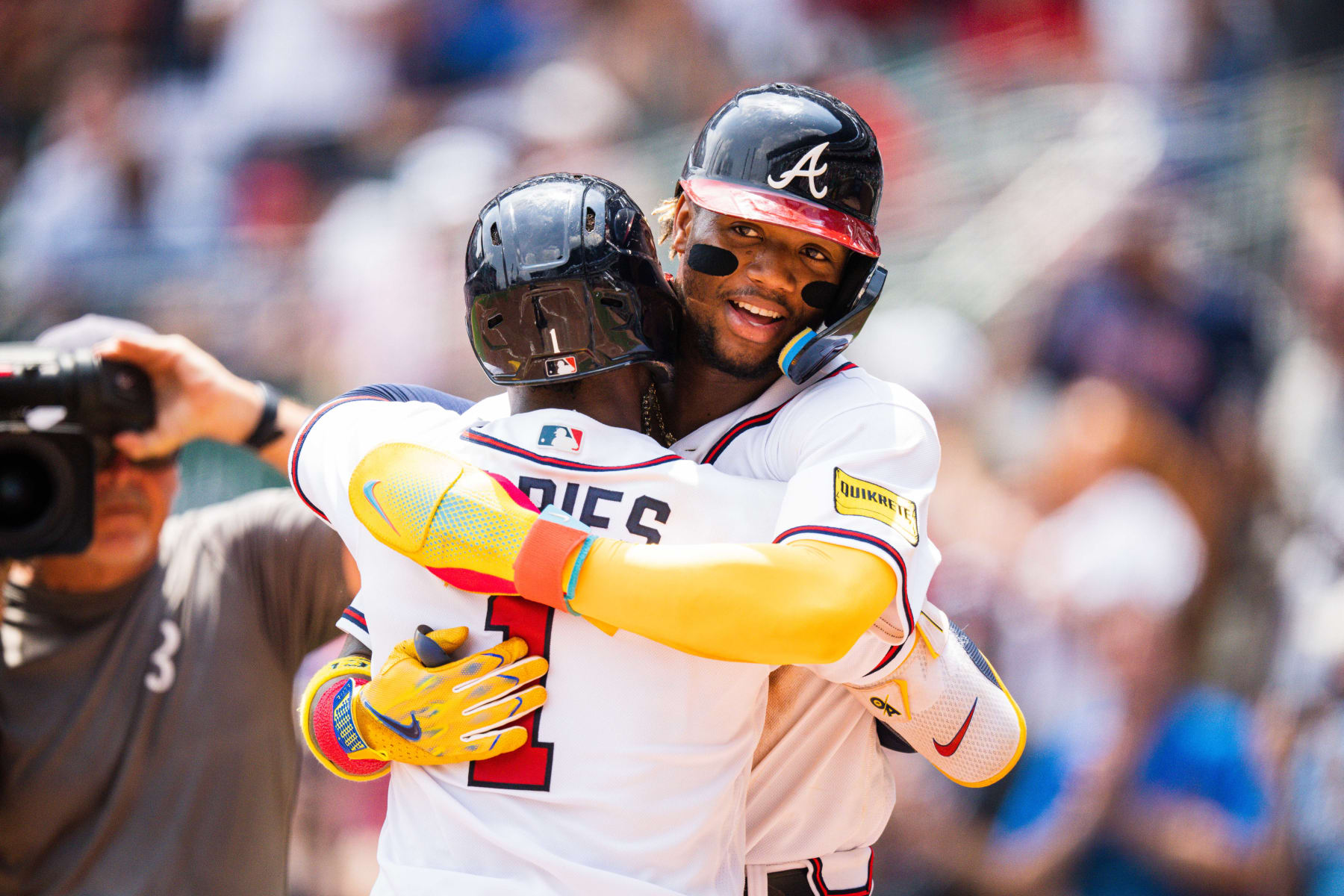 ATLANTA, GA - JULY 02: Ozzie Albies #1 of the Atlanta Braves is congratulated by Ronald Acuna Jr. #13 after hitting a home run during the fifth inning against the Miami Marlins at Truist Park on July 02, 2023 in Atlanta, Georgia. (Photo by Kevin D. Liles/Atlanta Braves/Getty Images)