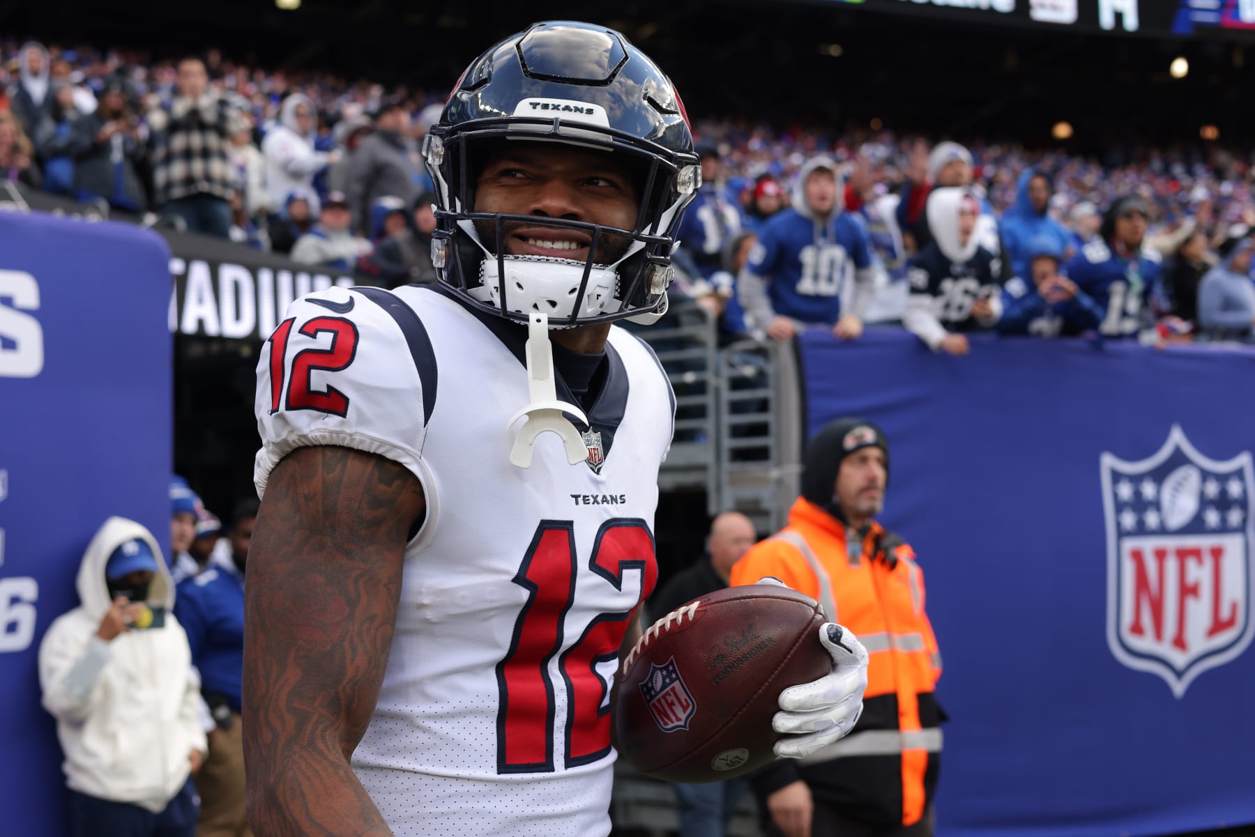 EAST RUTHERFORD, NEW JERSEY - NOVEMBER 13: Nico Collins #12 of the Houston Texans reacts after a touchdown during the third quarter in the game against the New York Giants at MetLife Stadium on November 13, 2022 in East Rutherford, New Jersey. (Photo by Jamie Squire/Getty Images)