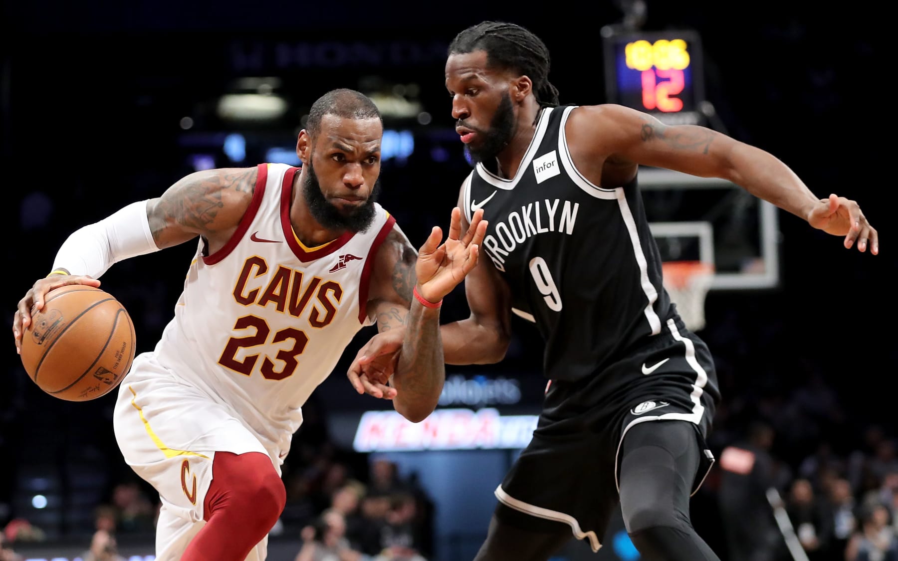 NEW YORK, NY - MARCH 25: LeBron James #23 of the Cleveland Cavaliers dribbles to the basket against DeMarre Carroll #9 of the Brooklyn Nets in the third quarter during their game at Barclays Center on March 25, 2018 in the Brooklyn borough of New York City. NOTE TO USER: User expressly acknowledges and agrees that, by downloading and or using this photograph, User is consenting to the terms and conditions of the Getty Images License Agreement.  (Photo by Abbie Parr/Getty Images)