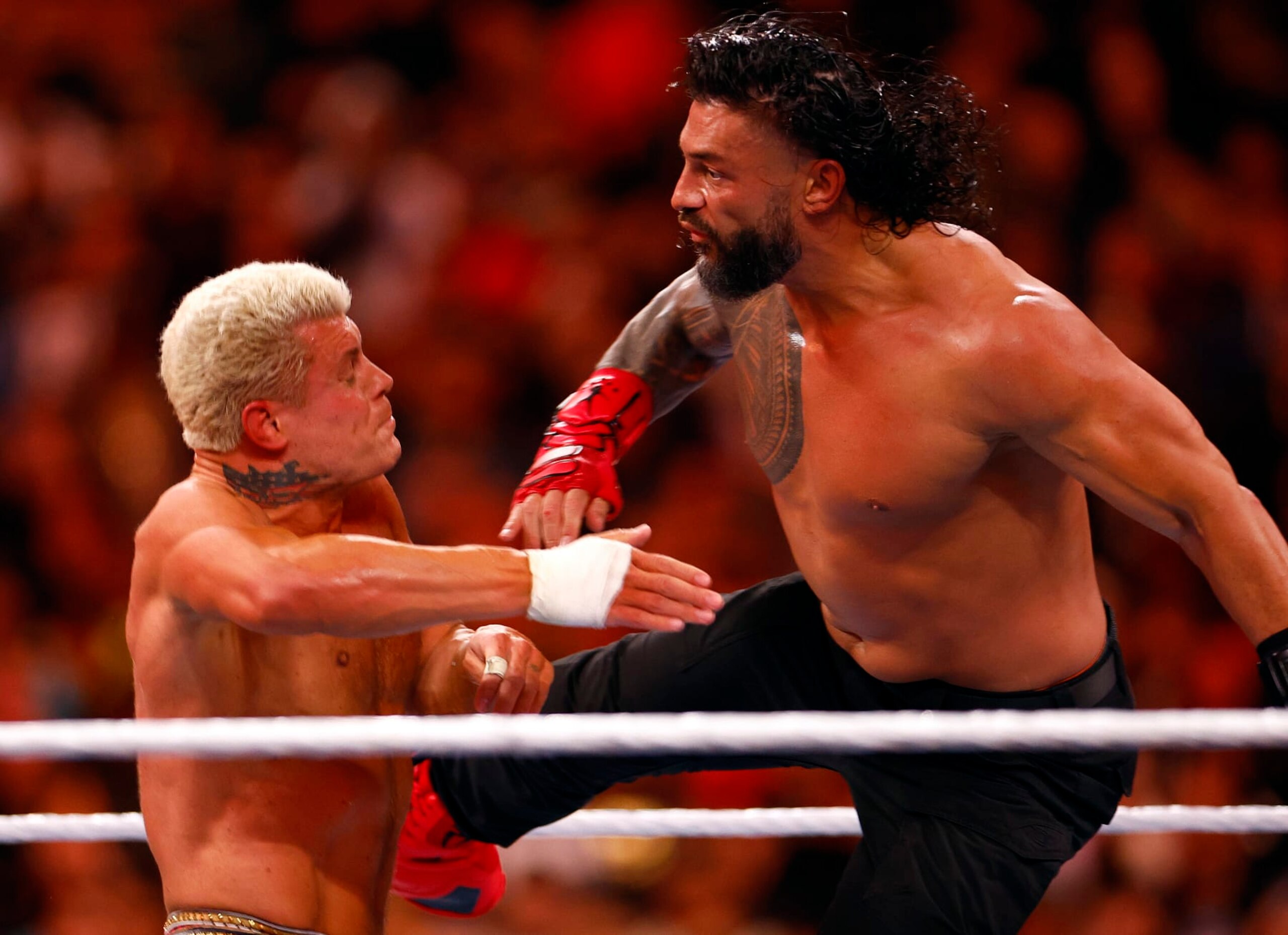 INGLEWOOD, CALIFORNIA - APRIL 02:  (L-R) Cody Rhodes wrestles Roman Reigns for Undisputed WWE Universal Title Match during WrestleMania Goes Hollywood at SoFi Stadium on April 02, 2023 in Inglewood, California.
 (Photo by Ronald Martinez/Getty Images)