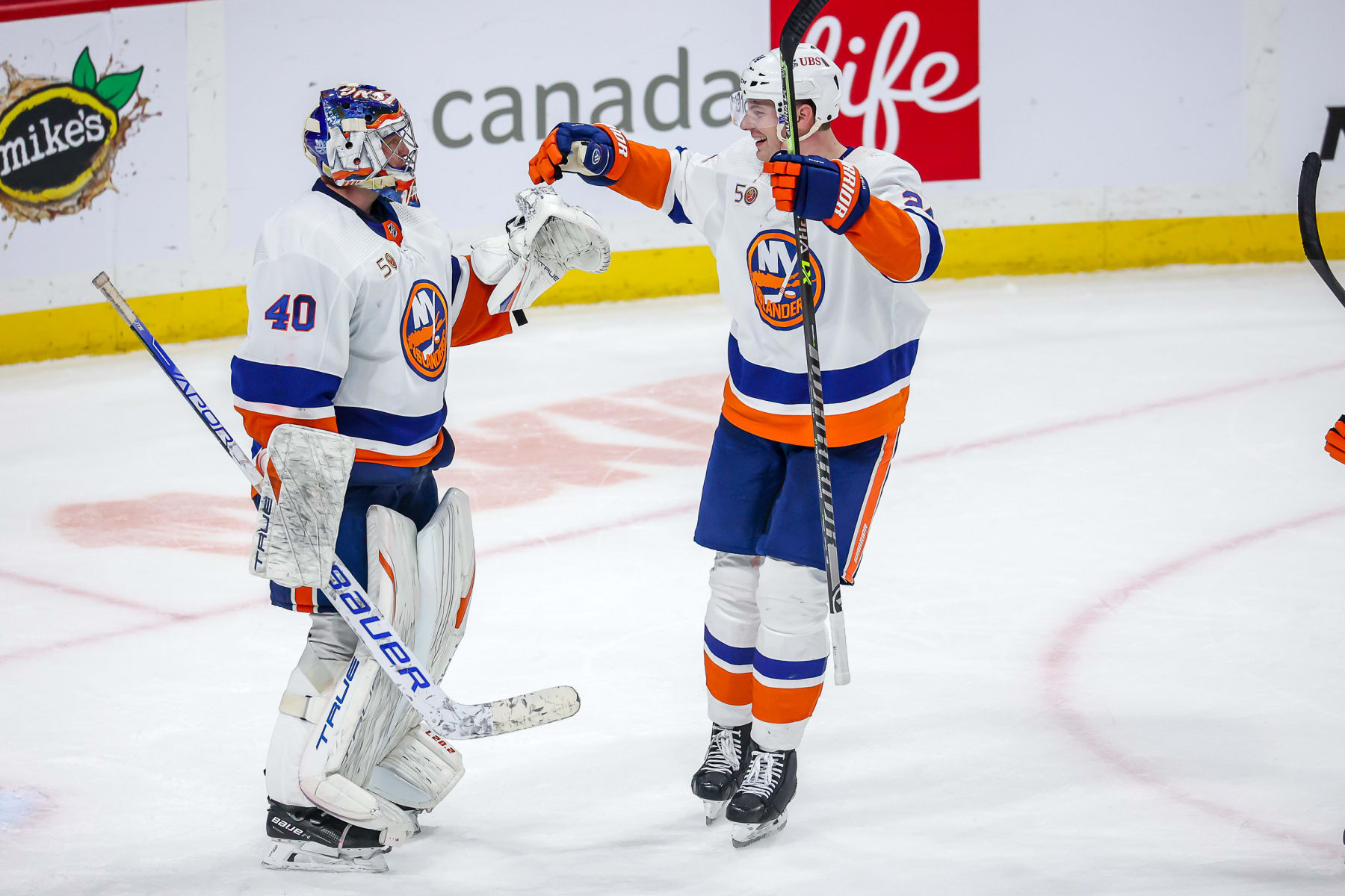 New York Islanders goaltender Semyon Varlamov and defenseman Scott Mayfield