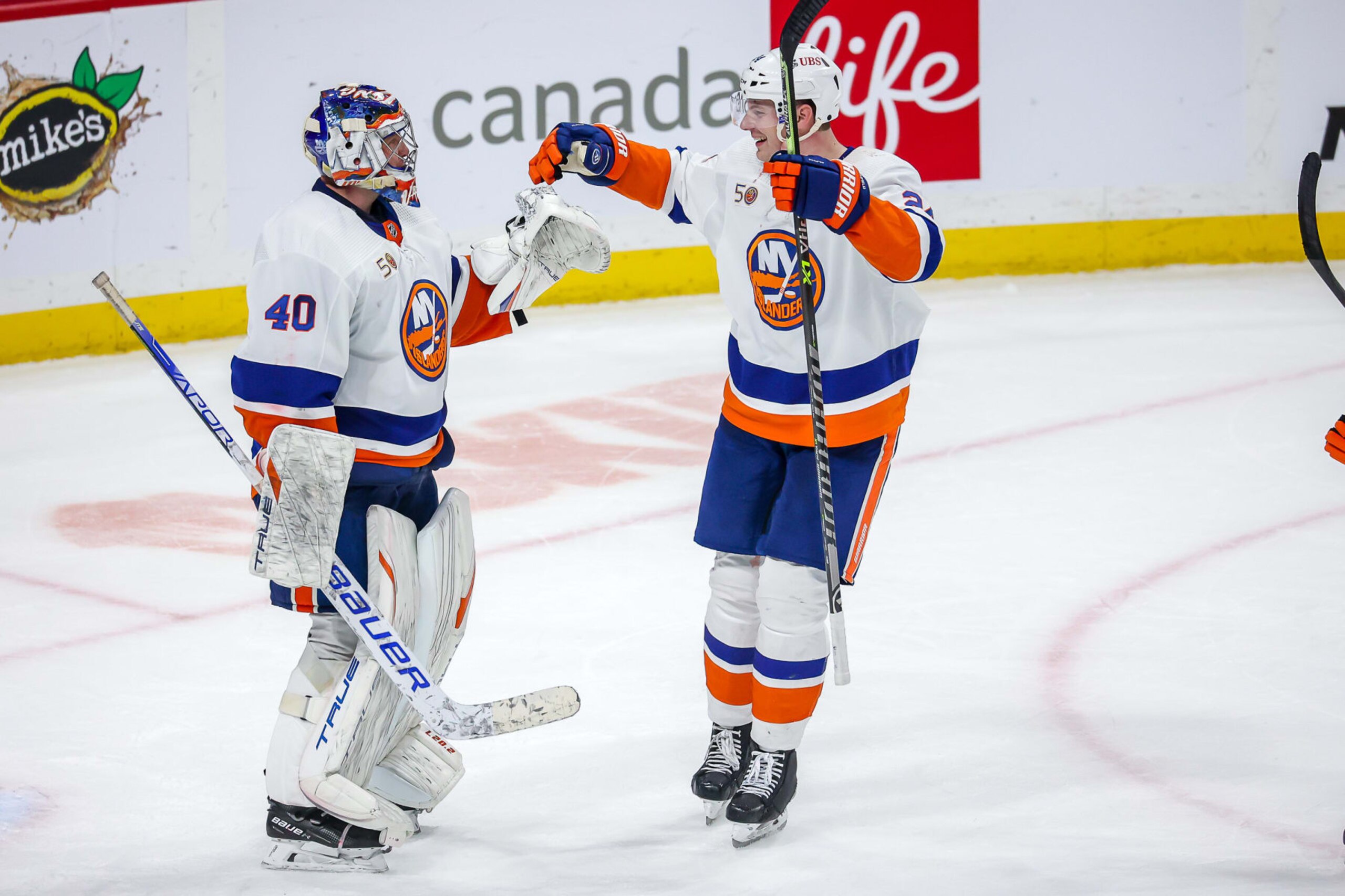 New York Islanders goaltender Semyon Varlamov and defenseman Scott Mayfield