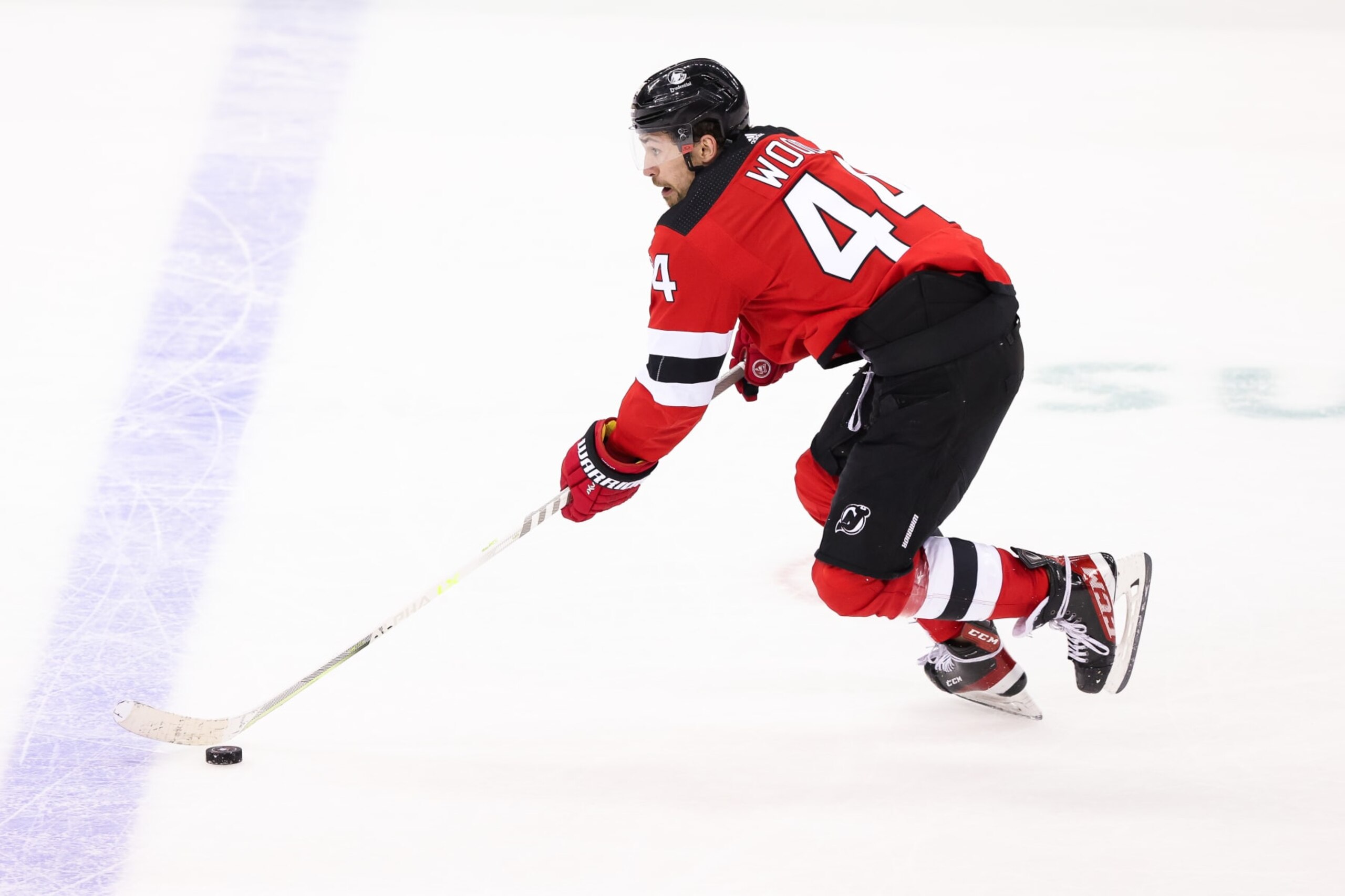 NEWARK, NJ - MAY 07: New Jersey Devils left wing Miles Wood (44) skates with the puck during Game 3 of an Eastern Conference Second Round playoff game between the Carolina Hurricanes and the New Jersey Devils on May 7, 2023, at Prudential Center in Newark, New Jersey. (Photo by Andrew Mordzynski/Icon Sportswire via Getty Images)
