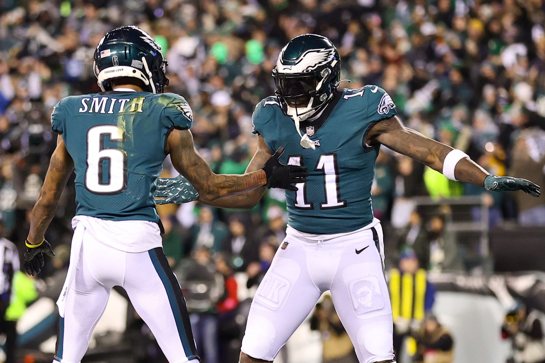 PHILADELPHIA, PENNSYLVANIA - JANUARY 21: DeVonta Smith #6 of the Philadelphia Eagles celebrates his touchdown with teammate A.J. Brown #11 during the first quarter against the New York Giants in the NFC Divisional Playoff game at Lincoln Financial Field on January 21, 2023 in Philadelphia, Pennsylvania. (Photo by Tim Nwachukwu/Getty Images)