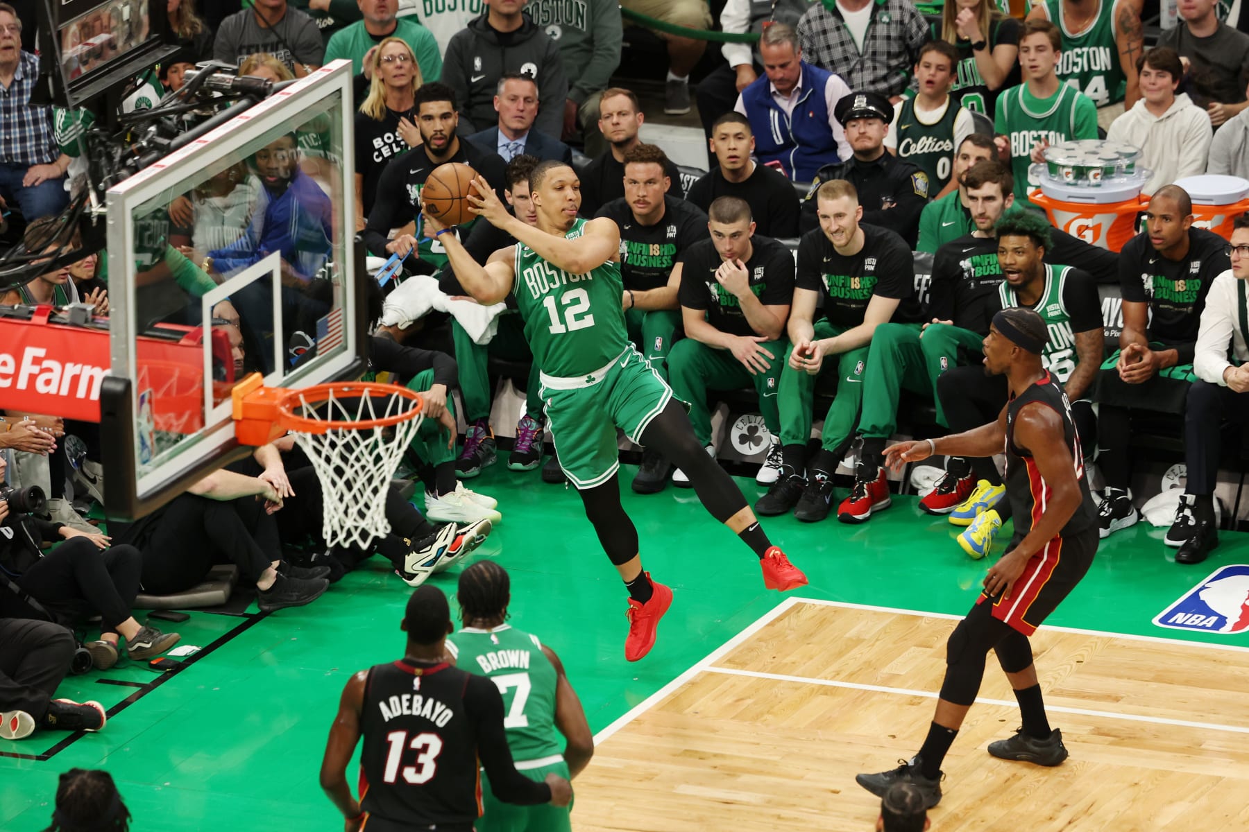 BOSTON, MASSACHUSETTS - MAY 29: Grant Williams #12 of the Boston Celtics attempts to keep the ball in bounds during the first quarter against the Miami Heat in game seven of the Eastern Conference Finals at TD Garden on May 29, 2023 in Boston, Massachusetts. NOTE TO USER: User expressly acknowledges and agrees that, by downloading and or using this photograph, User is consenting to the terms and conditions of the Getty Images License Agreement. (Photo by Adam Glanzman/Getty Images)