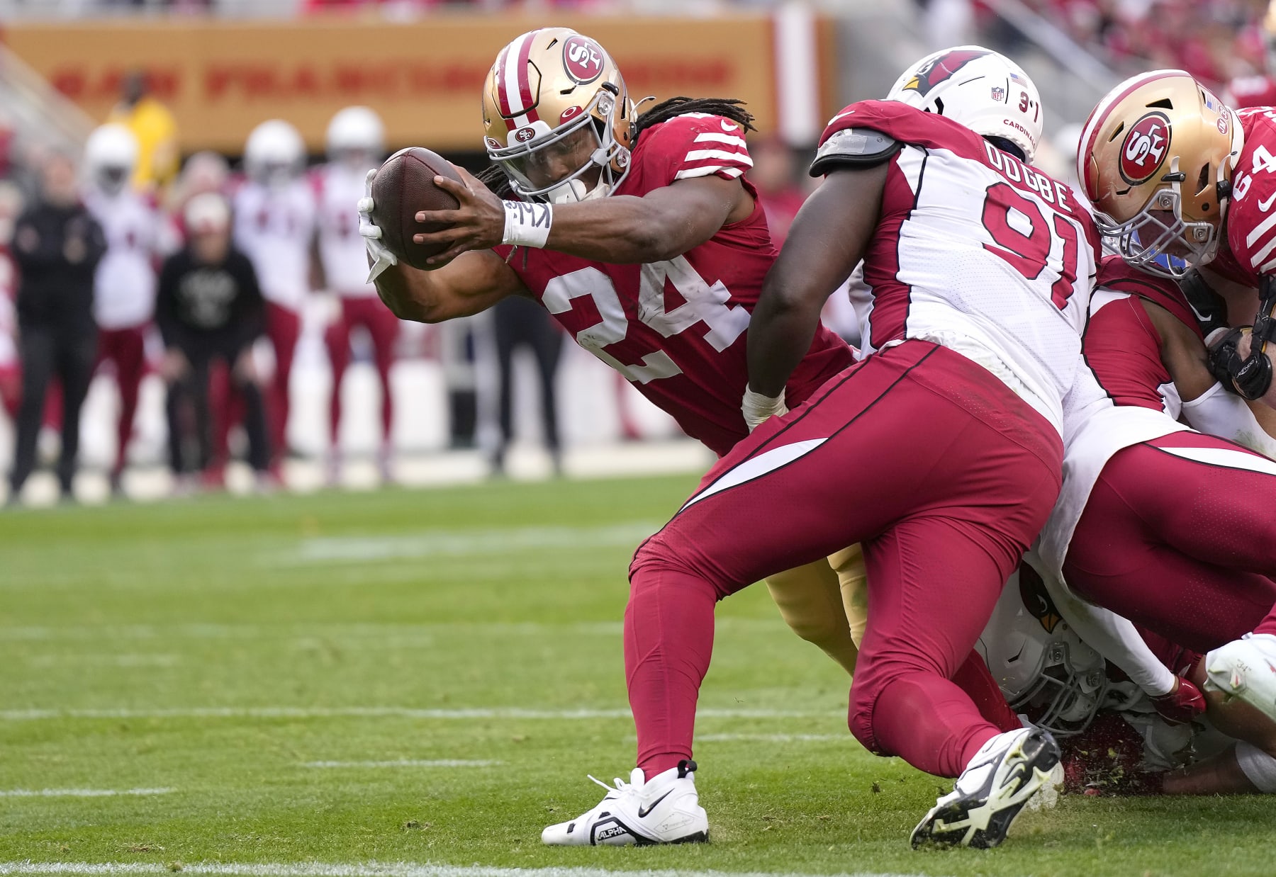 SANTA CLARA, CALIFORNIA - JANUARY 08: Jordan Mason #24 of the San Francisco 49ers dives for the endzone against the Arizona Cardinals during the third quarter of an NFL football game at Levi's Stadium on January 08, 2023 in Santa Clara, California. (Photo by Thearon W. Henderson/Getty Images)