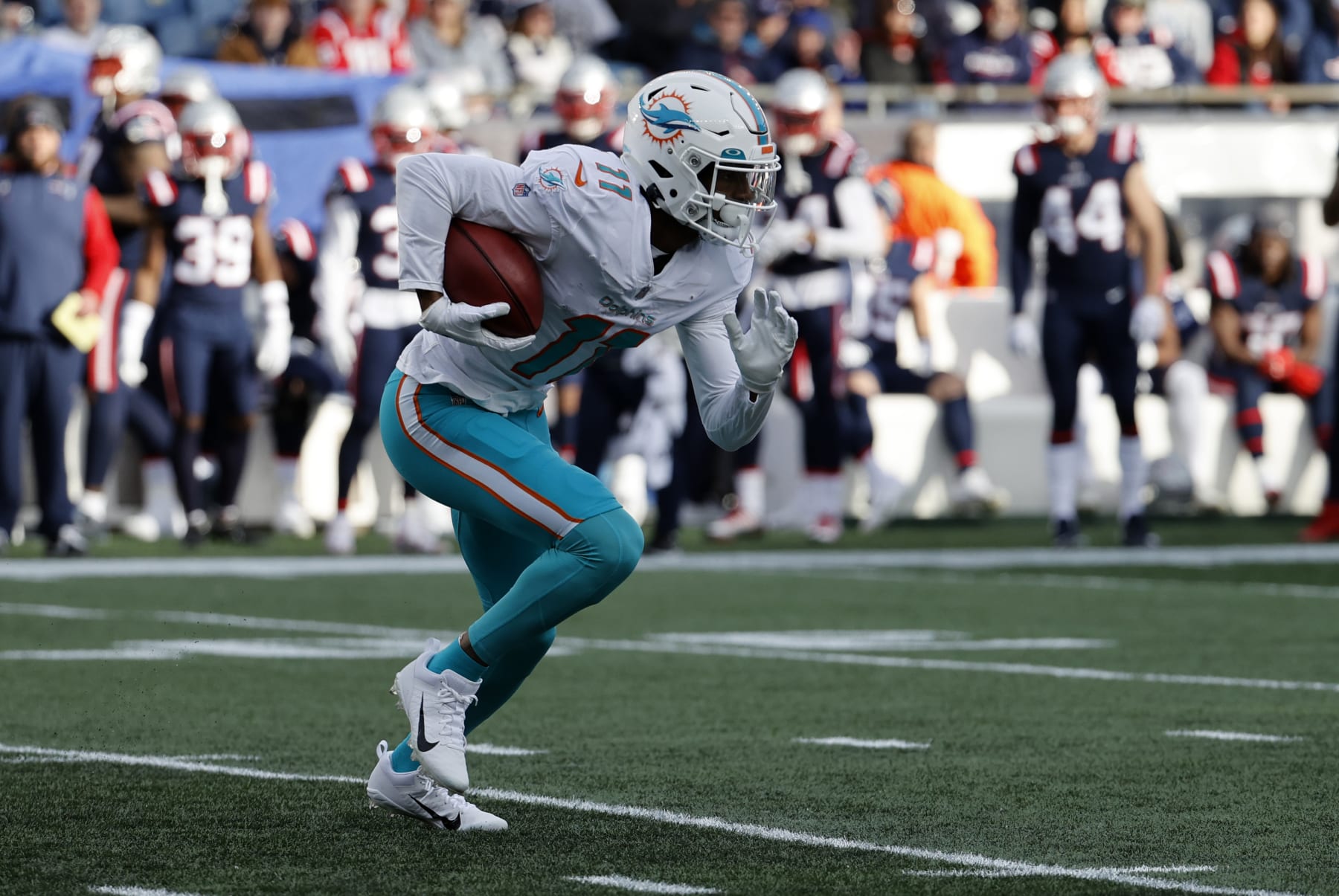 FOXBOROUGH, MA - JANUARY 01: Miami Dolphins wide receiver Cedrick Wilson Sr. (11) returns a kick during a game between the New England Patriots and the Miami Dolphins on January 1, 2023, at Gillette Stadium in Foxboro, Massachusetts. (Photo by Fred Kfoury III/Icon Sportswire via Getty Images)