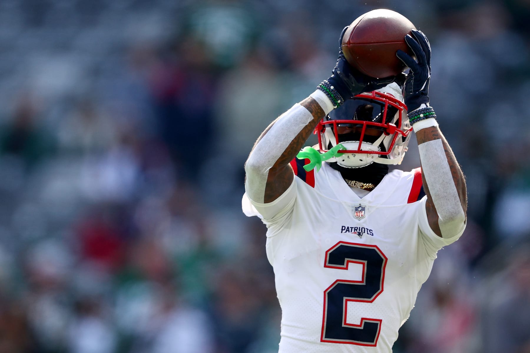 EAST RUTHERFORD, NEW JERSEY - OCTOBER 30: Jalen Mills #2 of the New England Patriots warms up before a game against the New York Jets at MetLife Stadium on October 30, 2022 in East Rutherford, New Jersey. (Photo by Elsa/Getty Images)