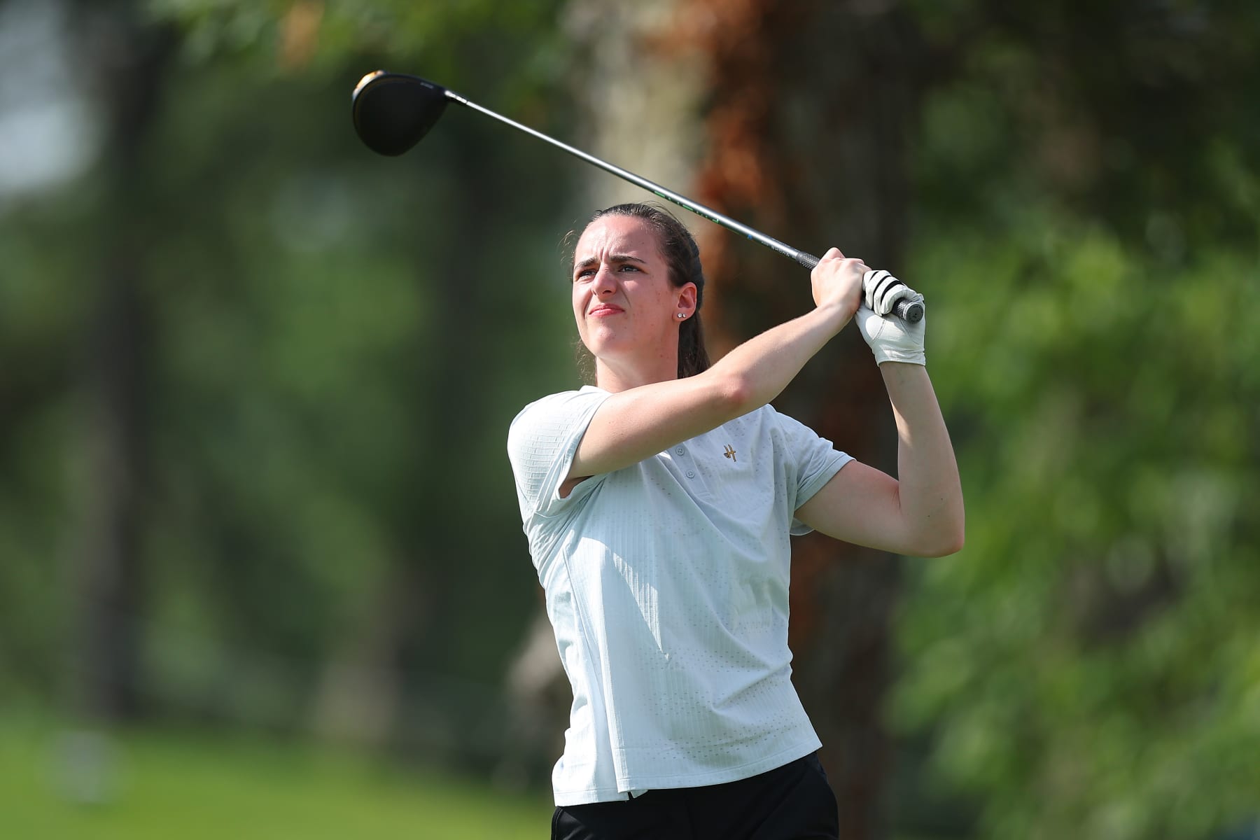 SILVIS, ILLINOIS - JULY 05: Caitlin Clark of the Iowa Hawkeyes plays a shot during the pro-am prior to the John Deere Classic at TPC Deere Run on July 05, 2023 in Silvis, Illinois. (Photo by Michael Reaves/Getty Images)