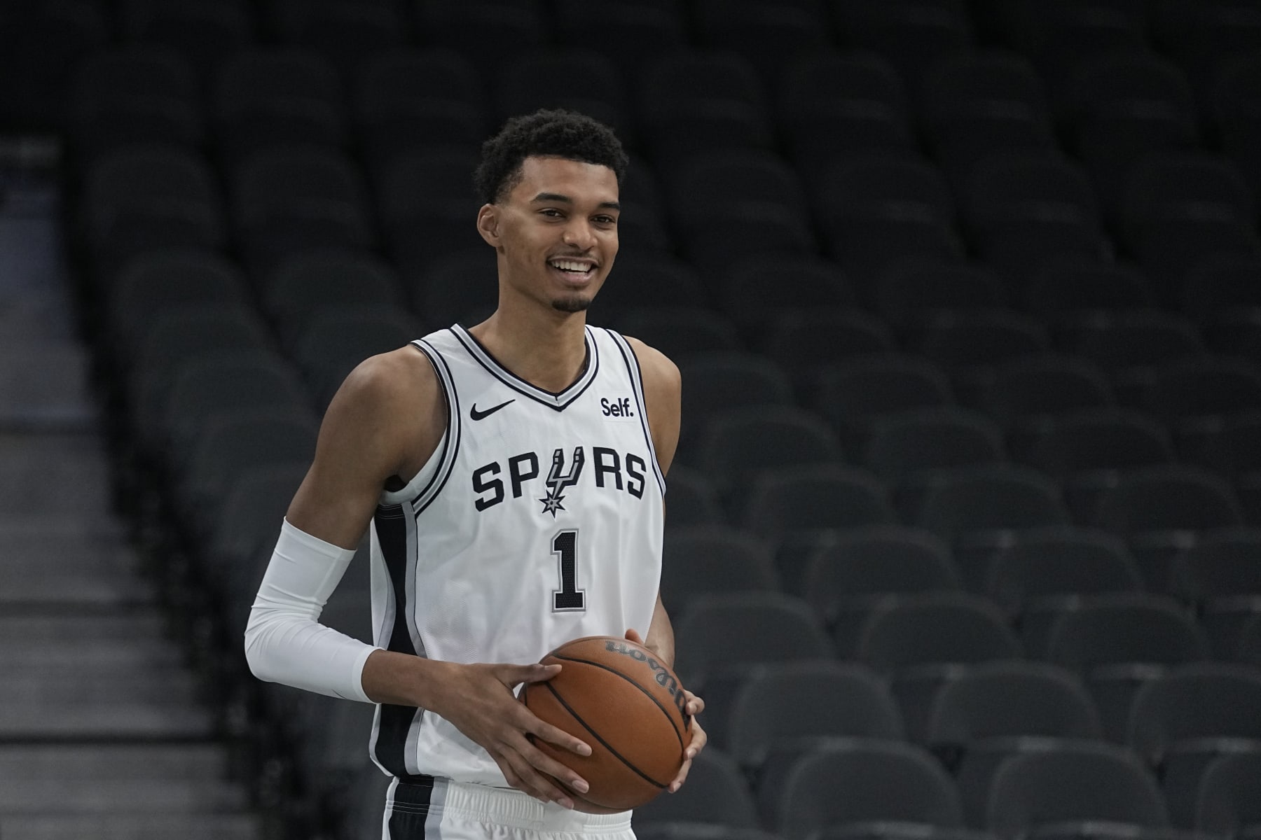 San Antonio Spurs NBA basketball first round draft pick Victor Wembanyama handles the ball following an introductory news conference in San Antonio, Saturday, June 24, 2023. (AP Photo/Eric Gay)