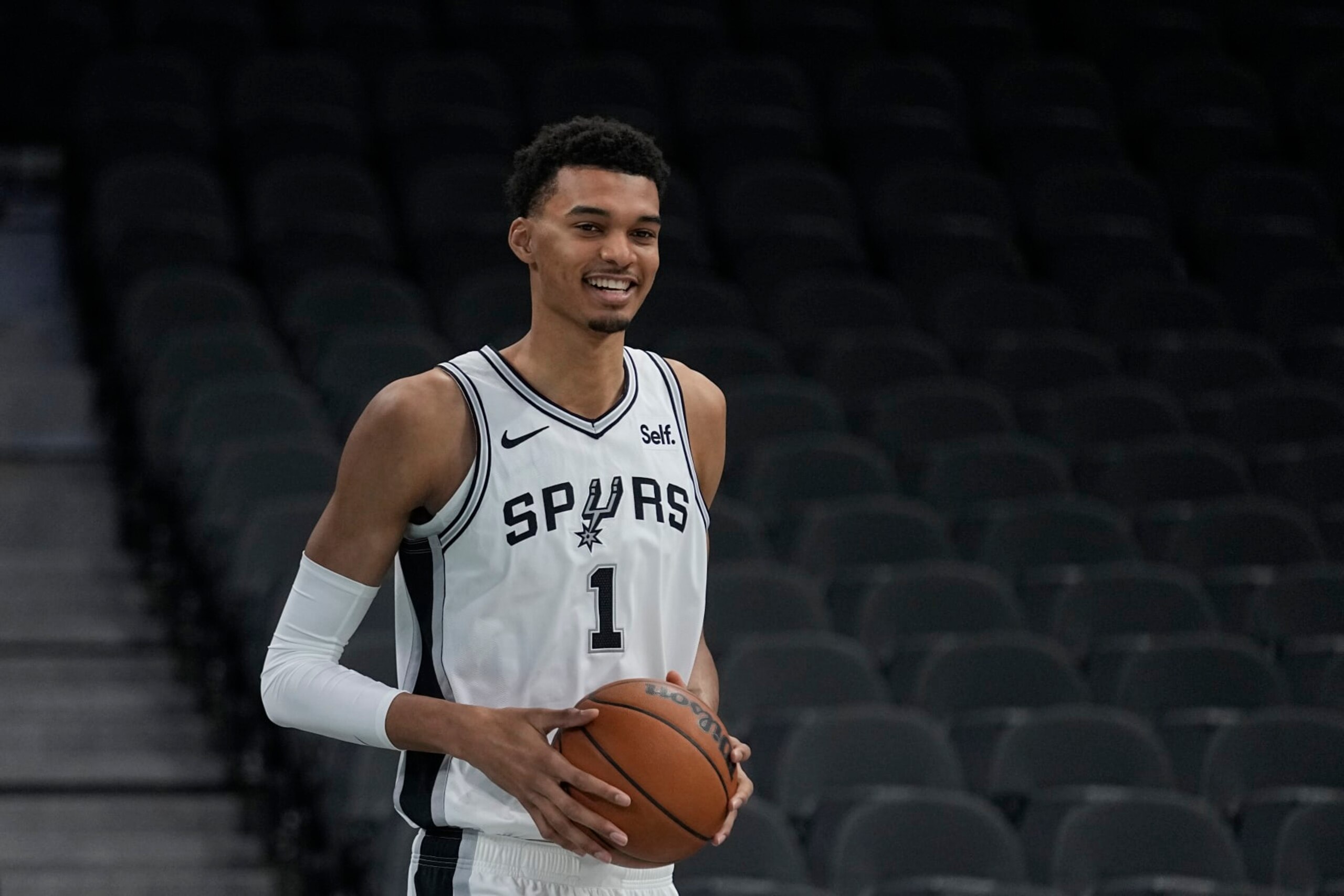San Antonio Spurs NBA basketball first round draft pick Victor Wembanyama handles the ball following an introductory news conference in San Antonio, Saturday, June 24, 2023. (AP Photo/Eric Gay)