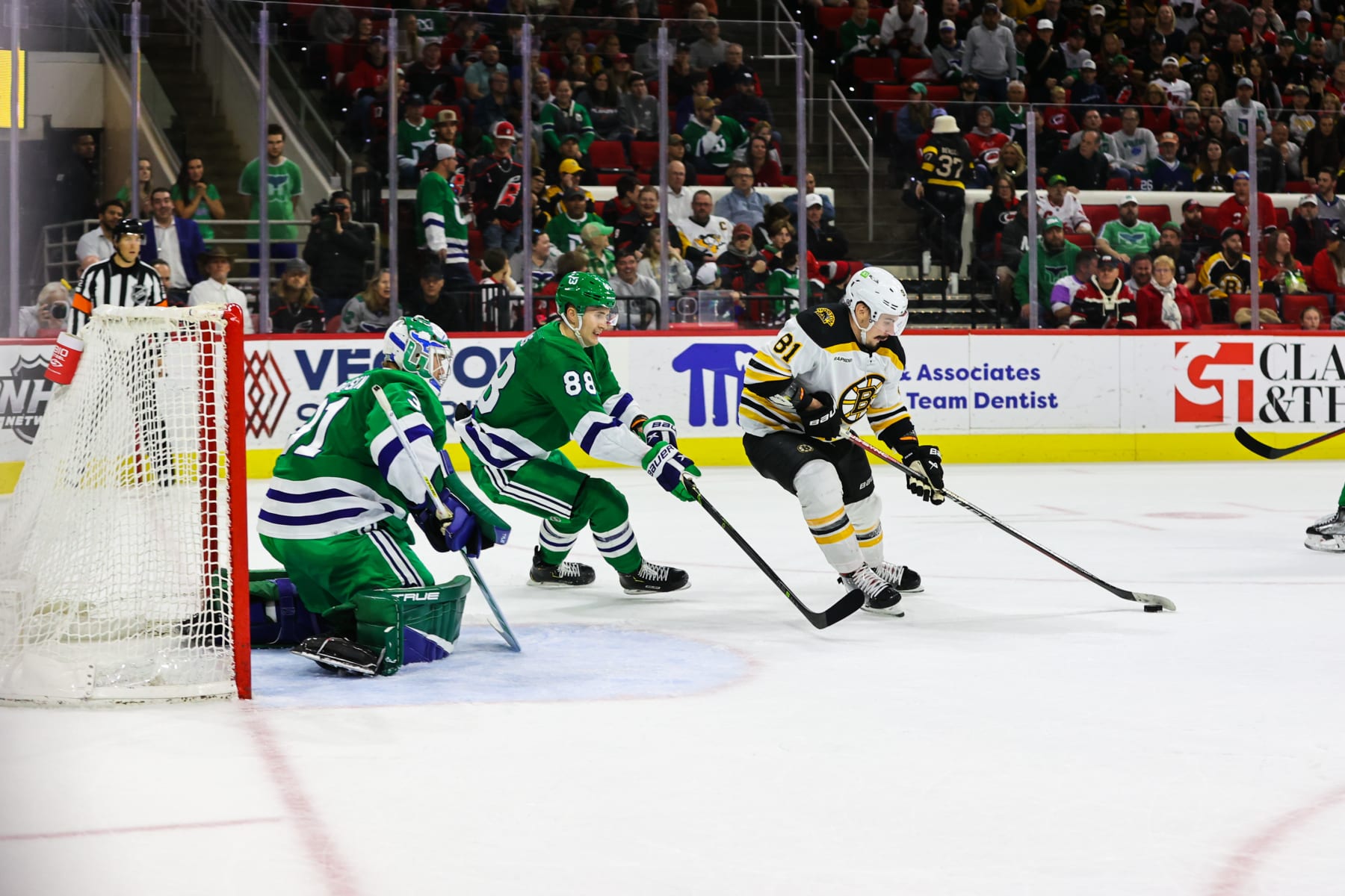 RALEIGH, NC - MARCH 26: Dmitry Orlov #81 of the Boston Bruins skates with the puck to try to score a goal during the third period of the game against the Boston Bruins at PNC Arena on March 26, 2023 in Raleigh, North Carolina. Bruins defeat Hurricanes 4-3. (Photo by Jaylynn Nash/Getty Images)