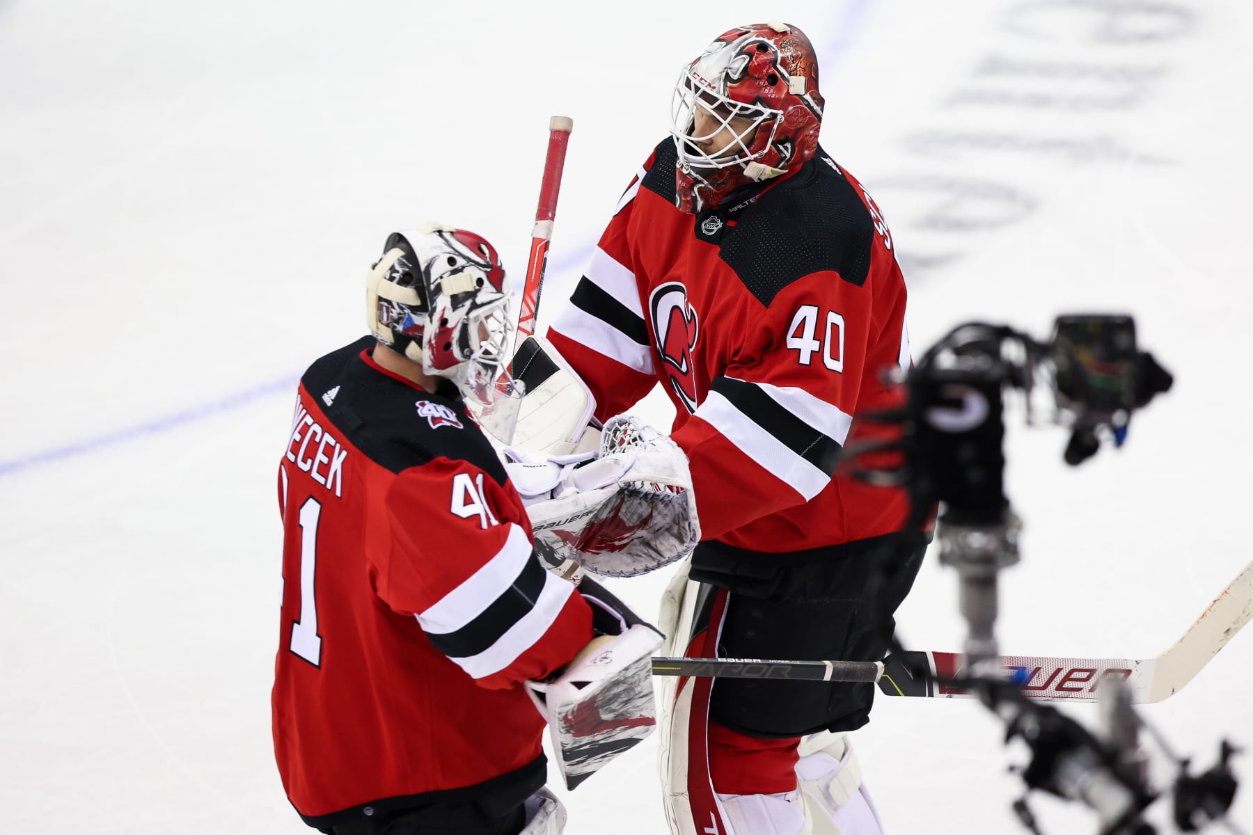 NEWARK, NJ - MAY 09: New Jersey Devils goaltender Akira Schmid (40) and New Jersey Devils goaltender Vitek Vanecek (41) switch positions during Game 4 of an Eastern Conference Second Round playoff game between the Carolina Hurricanes and the New Jersey Devils on May 9, 2023, at Prudential Center in Newark, New Jersey. (Photo by Andrew Mordzynski/Icon Sportswire via Getty Images)